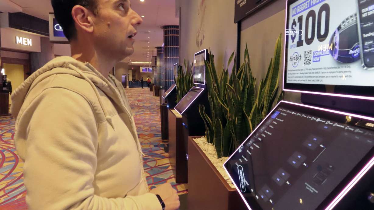 Matt Smircich, of Hamburg, N.J., makes sports bets at the Hard Rock casino in Atlantic City, N.J., Friday, Feb. 2, 2024. On Tuesday, Feb. 6, 2024, the American Gaming Association estimated that a record 68 million Americans would wager a total of $23.1 billion on this year's Super Bowl, legally or otherwise.