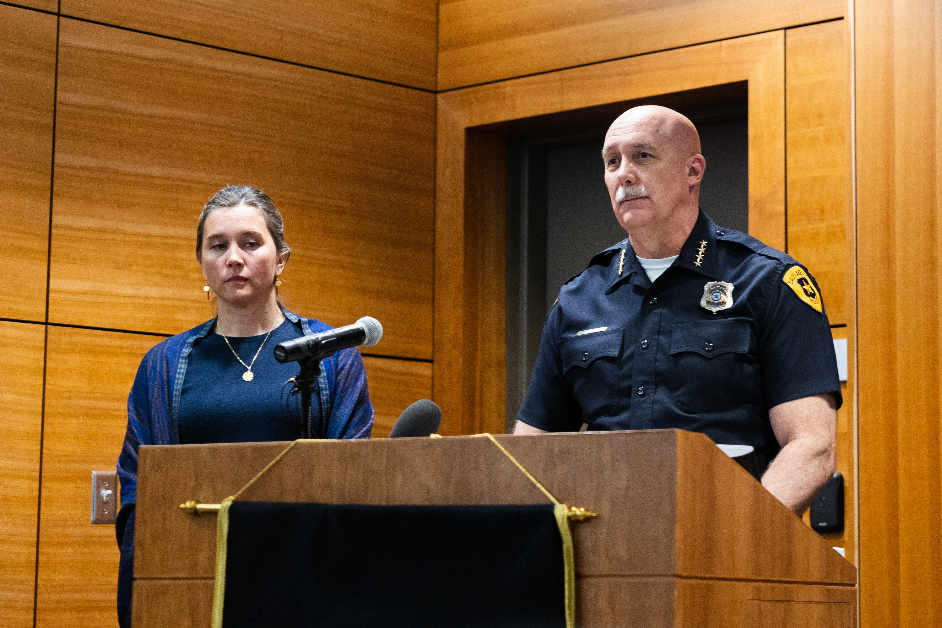 Salt Lake City Police Chief Mike Brown stands next to Salt Lake City Mayor Erin Mendenhall during a Project Safe Neighborhoods community update on April 27, 2023. The two leaders announced Monday that their city reached a 15-year low in overall crime in 2023.