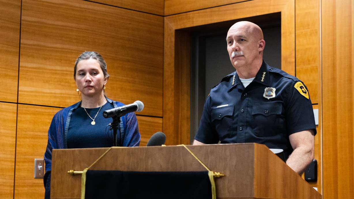 Salt Lake City Police Chief Mike Brown stands next to Salt Lake City Mayor Erin Mendenhall during a Project Safe Neighborhoods community update on April 27, 2023. The two leaders announced Monday that their city reached a 15-year low in overall crime in 2023.