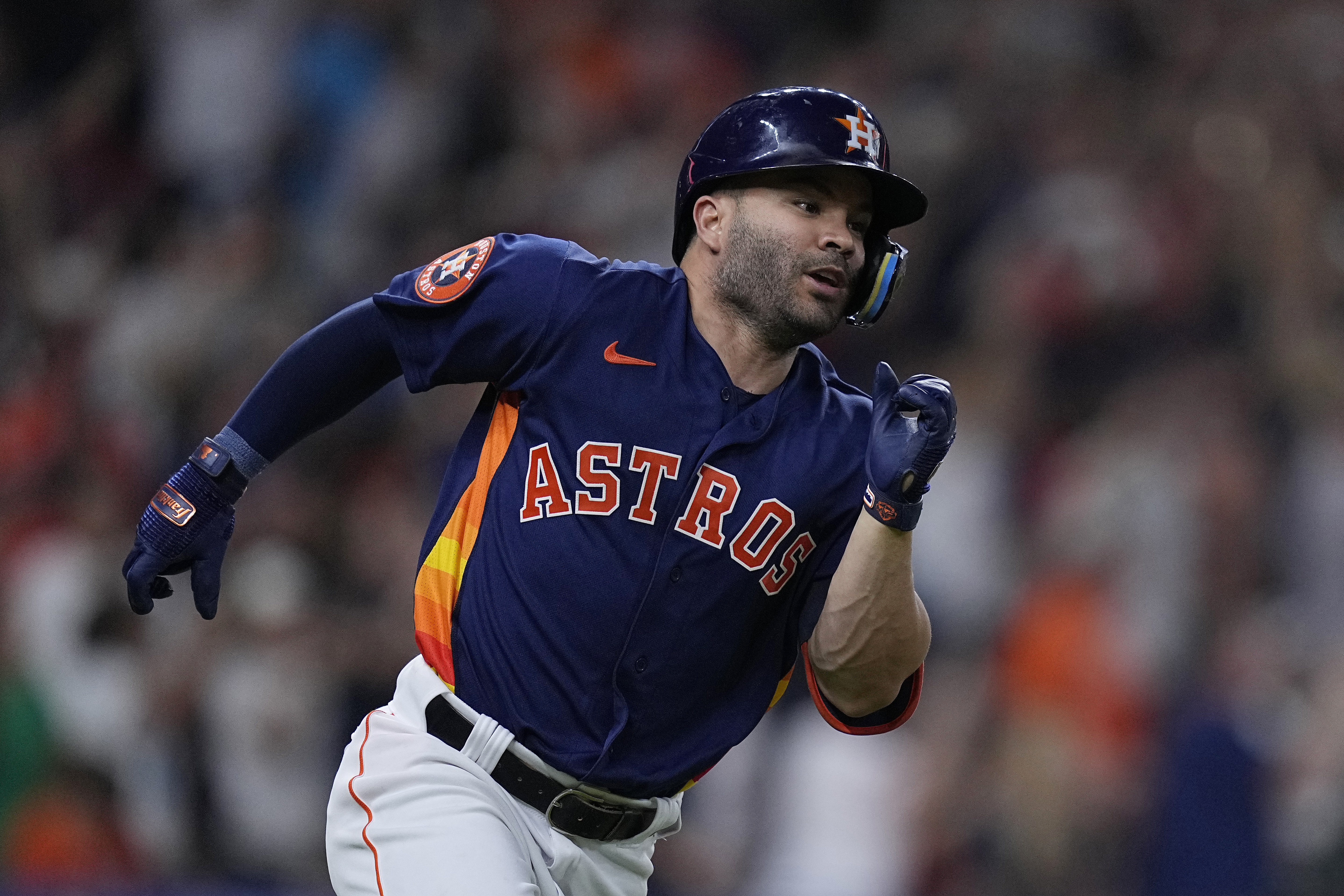 FILE - Houston Astros' José Altuve runs after his 2,000th career hit, a single off Seattle Mariners starting pitcher Logan Gilbert, during the fifth inning of a baseball game Aug. 19, 2023, in Houston. Altuve and the Astros agreed to a $125 million, five-year contract that covers 2025-29. Houston announced a new multiyear deal Tuesday, Feb. 6, 2024, without disclosing details.