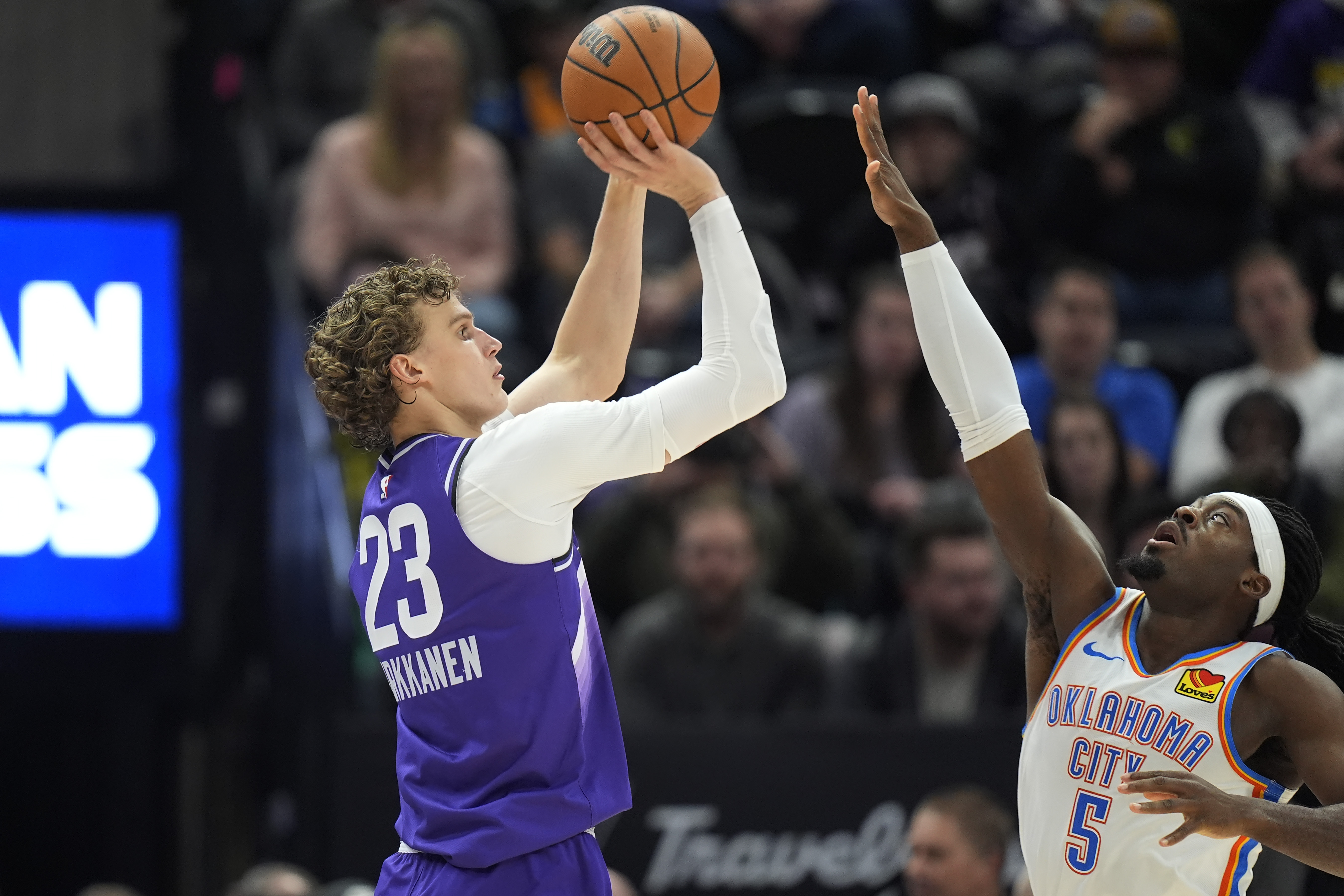 Utah Jazz forward Lauri Markkanen (23) shoots as Oklahoma City Thunder guard Luguentz Dort (5) defends during the first half of an NBA basketball game Tuesday, Feb. 6, 2024, in Salt Lake City.