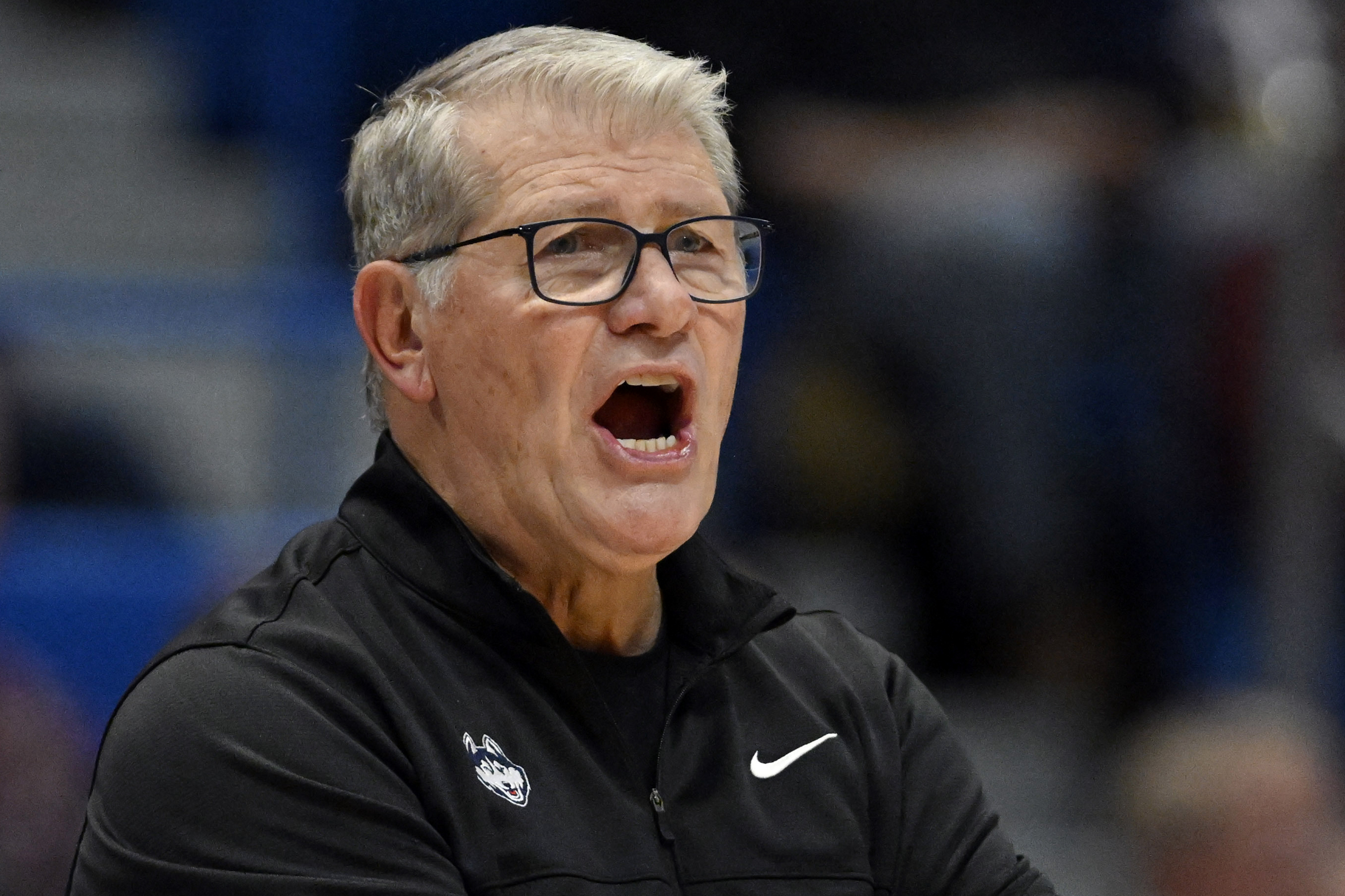 FILE - UConn head coach Geno Auriemma calls out to his team in the second half of an NCAA college basketball game against Dayton, Wednesday, Nov. 8, 2023, in Hartford, Conn. Auriemma says he's less excited than his staff about the prospect of becoming the third coach in Division I college basketball history to reach 1,200 wins. It's a milestone the Hall of Famer could get on Wednesday night, Feb. 7, 2024, when his No. 11 UConn Huskies face Seton Hall in Hartford. 