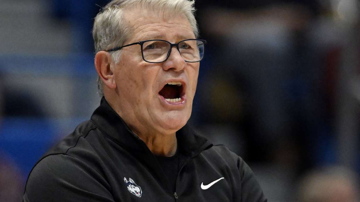 FILE - UConn head coach Geno Auriemma calls out to his team in the second half of an NCAA college basketball game against Dayton, Wednesday, Nov. 8, 2023, in Hartford, Conn. Auriemma says he's less excited than his staff about the prospect of becoming the third coach in Division I college basketball history to reach 1,200 wins. It's a milestone the Hall of Famer could get on Wednesday night, Feb. 7, 2024, when his No. 11 UConn Huskies face Seton Hall in Hartford.
