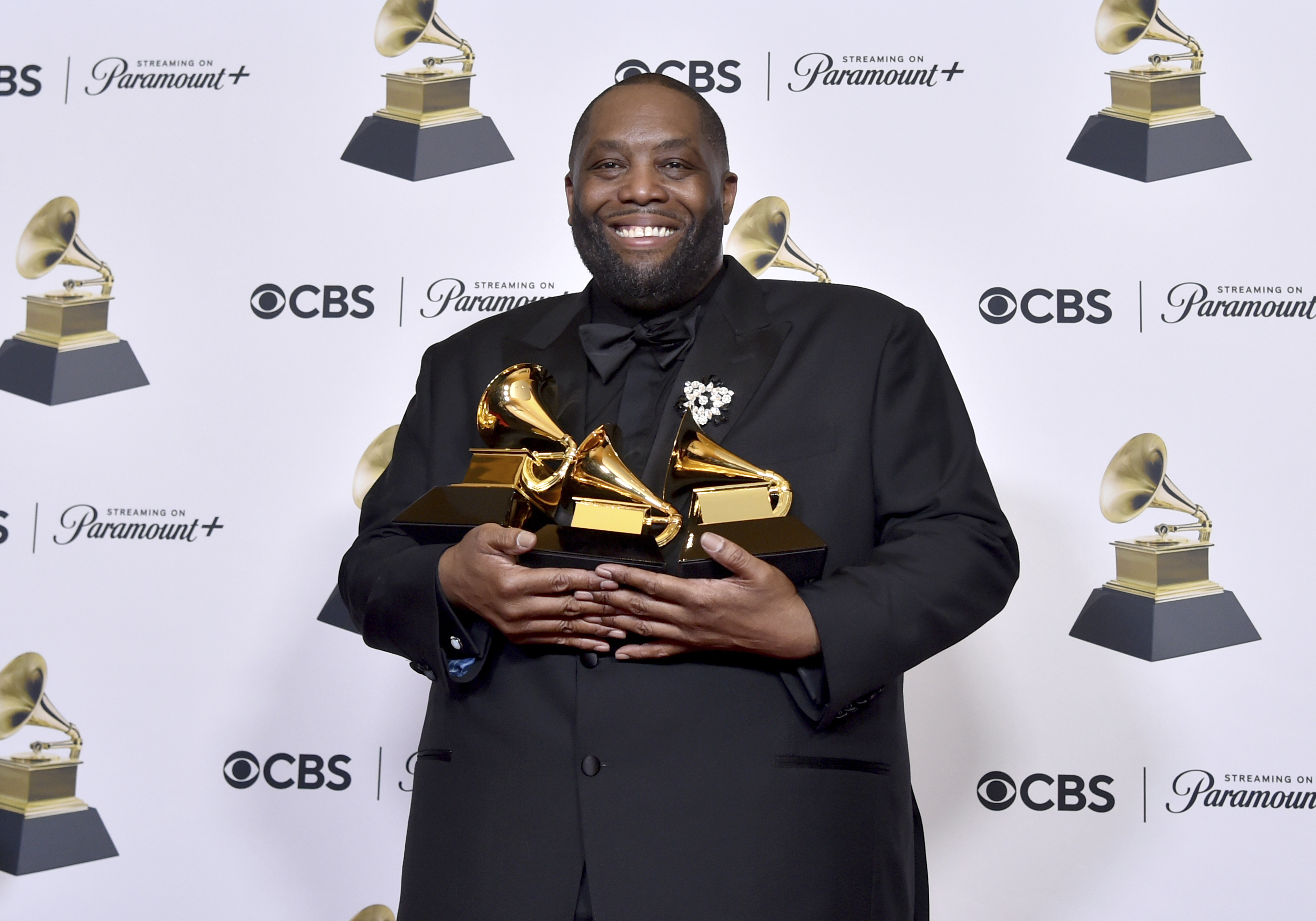 Killer Mike poses in the press room with three trophies he won at the 66th annual Grammy Awards on Feb. 4. Killer Mike is one of the artists set to perform at this year's Ogden Twilight Concert Series.