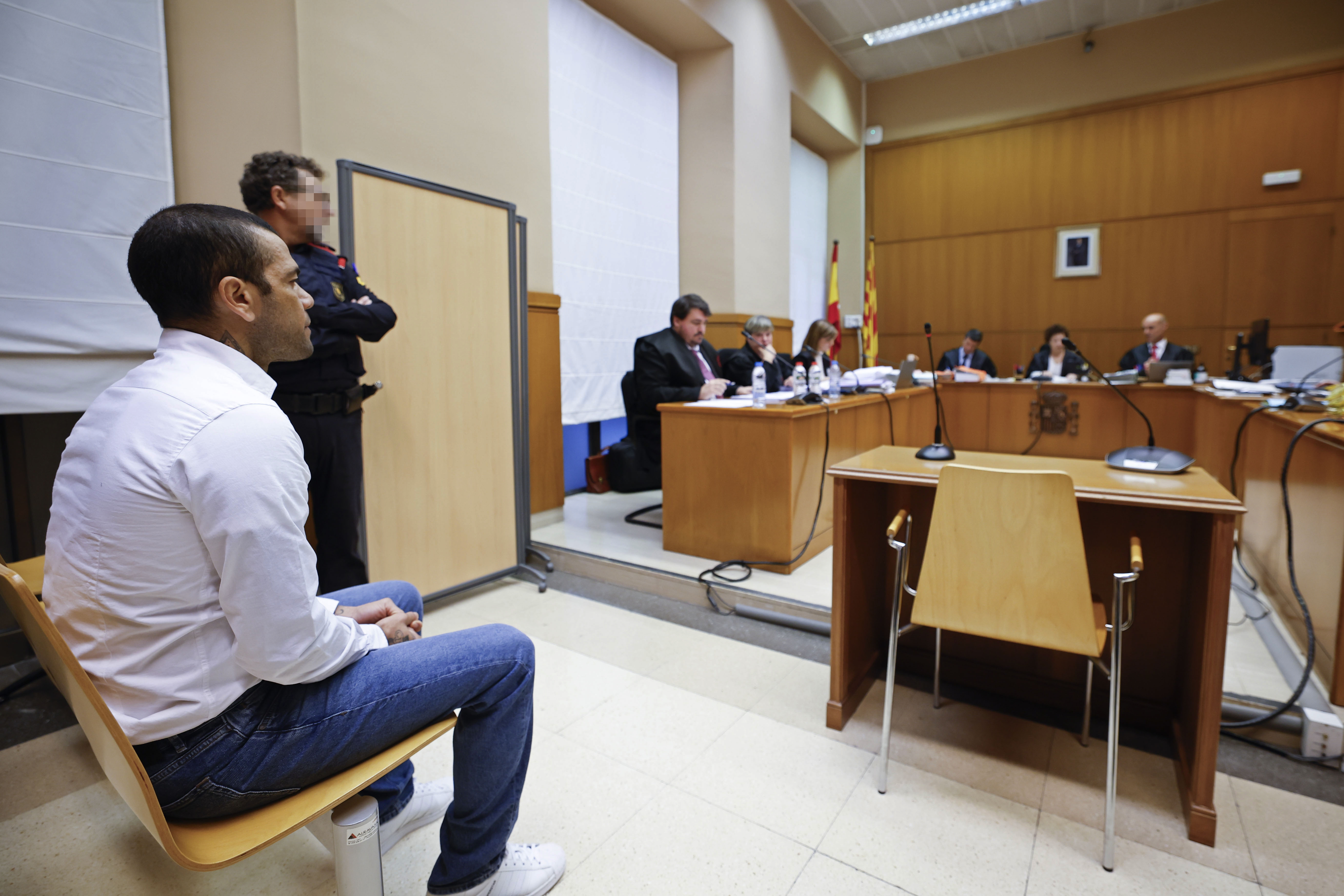 Brazilian soccer star Dani Alves sits during his trial in Barcelona, Spain, Monday, Feb. 5, 2024. Dani Alves goes on trial Monday a year after he allegedly sexually assaulted a young woman at a Barcelona nightclub. The 40-year-old Alves is accused of sexually assaulting the woman on the night of Dec. 30, 2022. He denies any wrongdoing