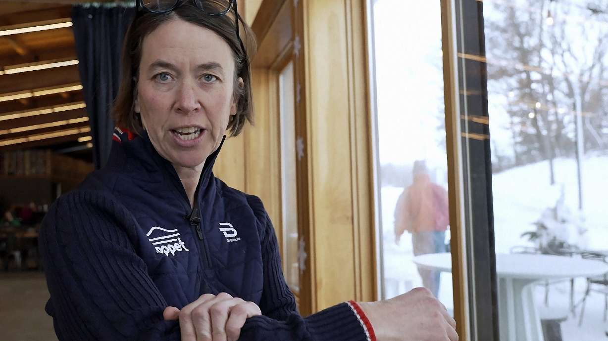 FILE -Claire Wilson, executive director of The Loppet Foundation, a non-profit that promotes winter recreation, demonstrates a wool base layer on Thursday, Jan. 18, 2024 in Minneapolis. The long road of bringing the World Cup in cross country skiing back to the U.S. has hit one final speed bump with the lack of snow in Minnesota. The Twin Cities metro area is on pace for the least snowy winter on record.