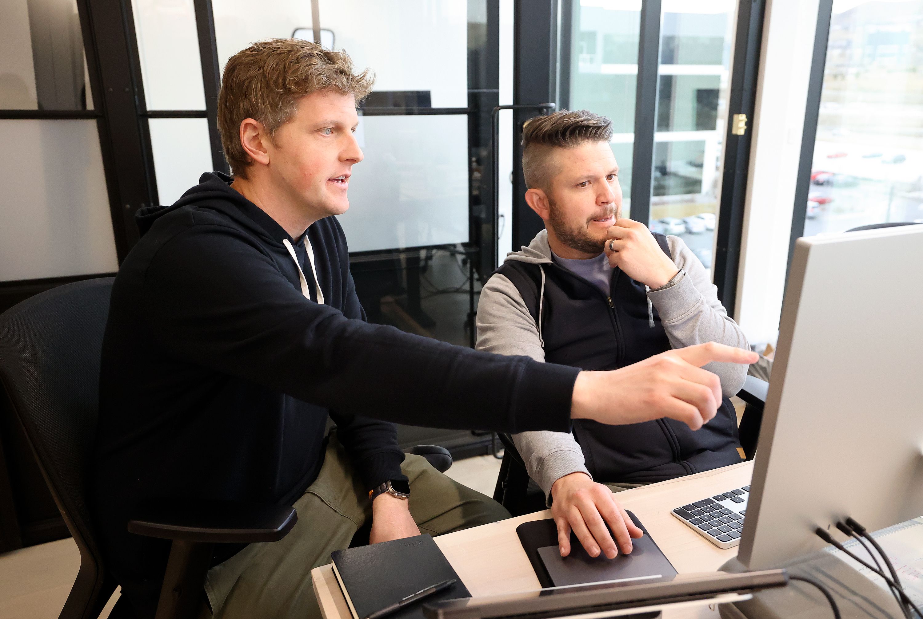 Caleb Hicks, School AI founder, and Cahlan Sharp, School AI chief technology officer, work at School AI headquarters in Lehi on Feb. 1.