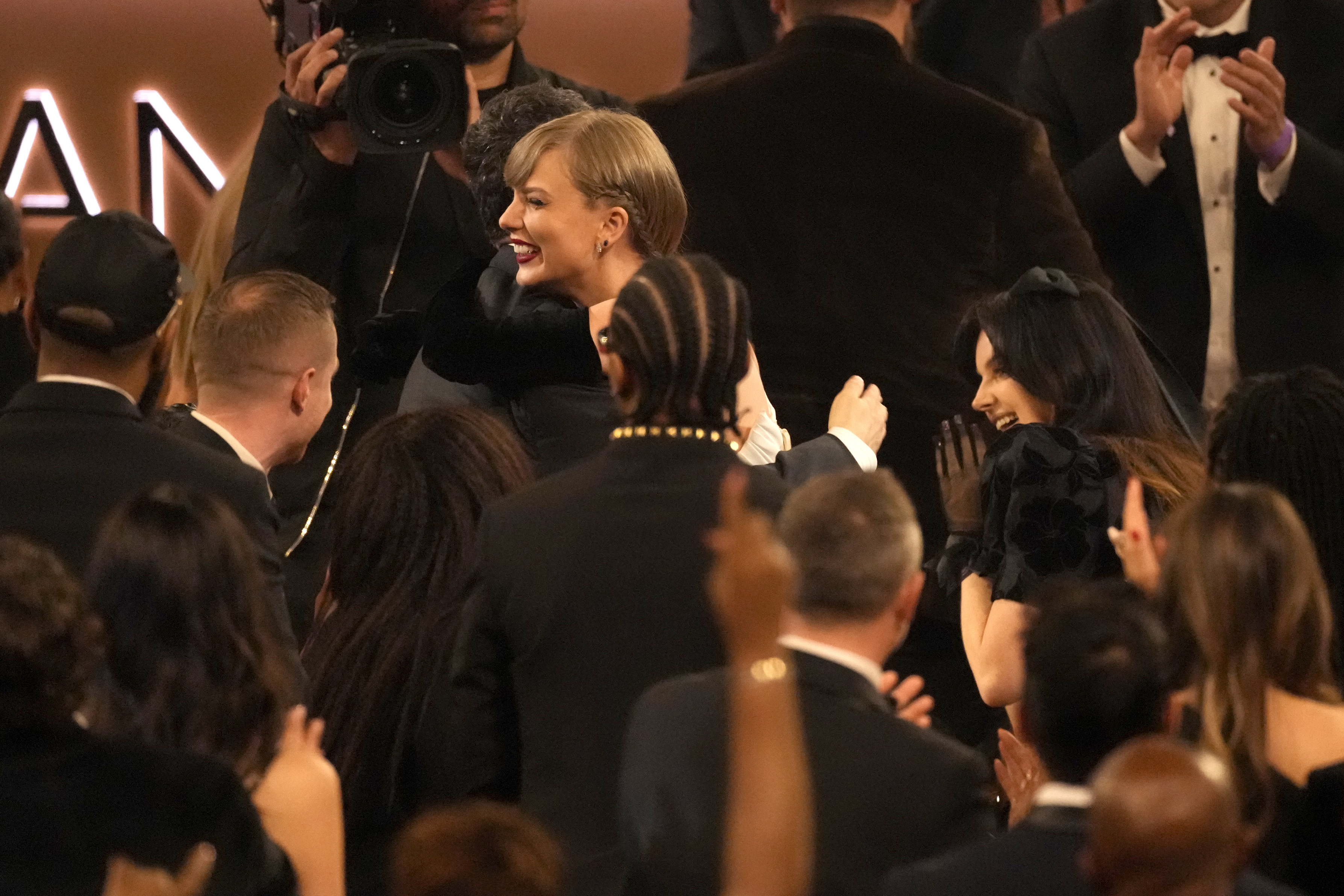 Jack Antonoff, left, and Taylor Swift embrace as Swift wins the award for best pop vocal album for "Midnights" during the 66th annual Grammy Awards on Sunday, Feb. 4, 2024, in Los Angeles. 