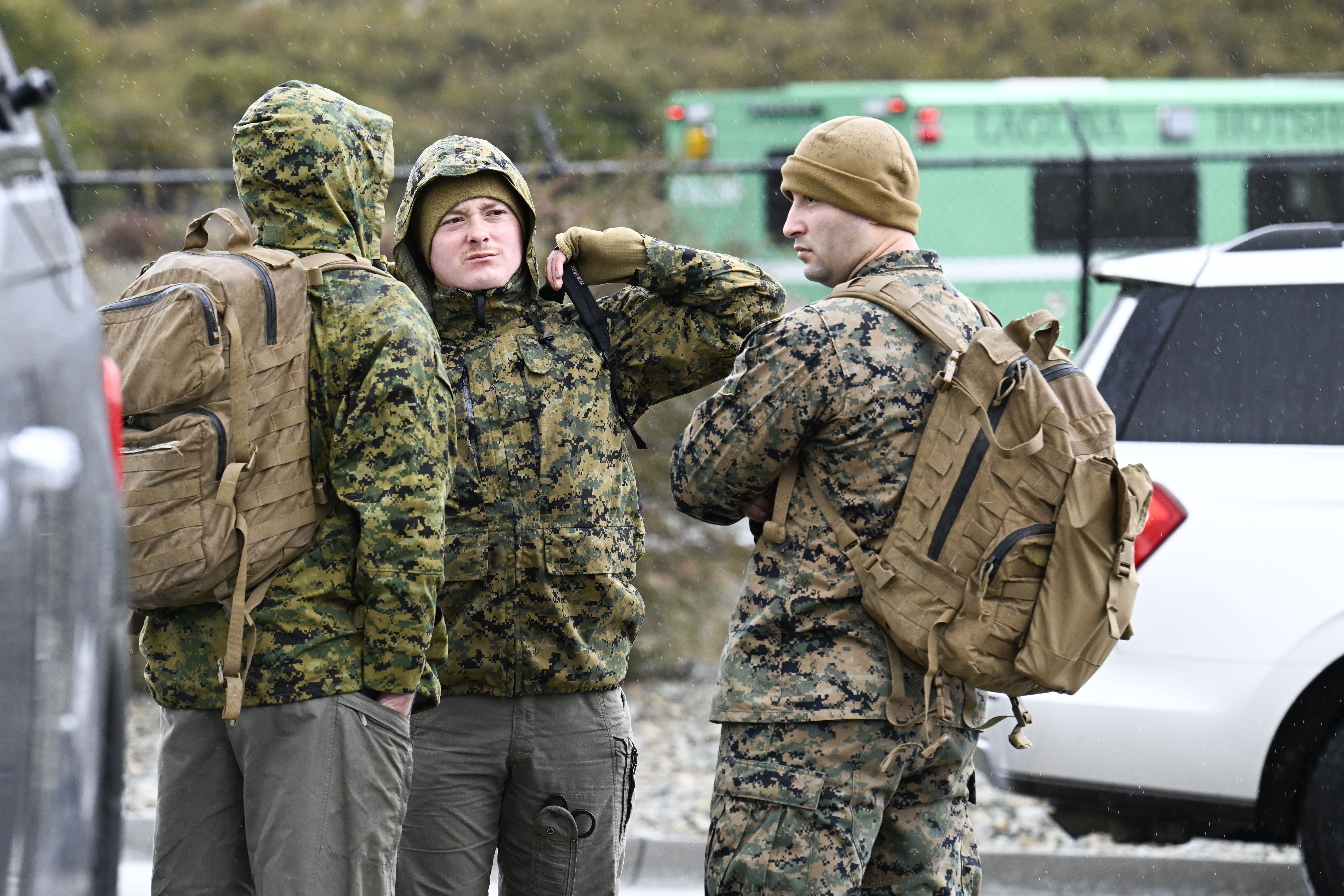 Marines wait to leave a command center, Wednesday, in Kitchen Creek, Calif. A Marine Corps helicopter that had been missing with five troops aboard was found Wednesday outside San Diego. The Marines confirmed Thursday that all people on the missing aircraft died.