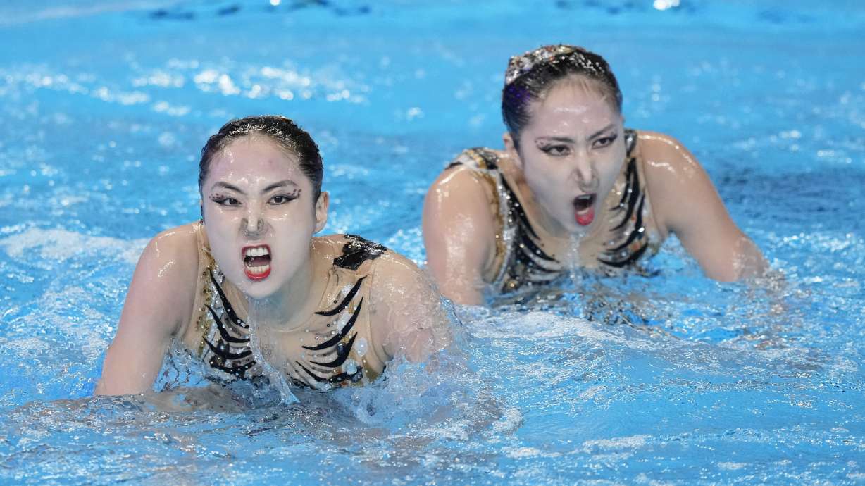 Wang Liuyi and Wang Qianyi, of China, compete in the women's duet free final of artistic swimming at the World Aquatics Championships in Doha, Qatar, Thursday, Feb. 8, 2024.