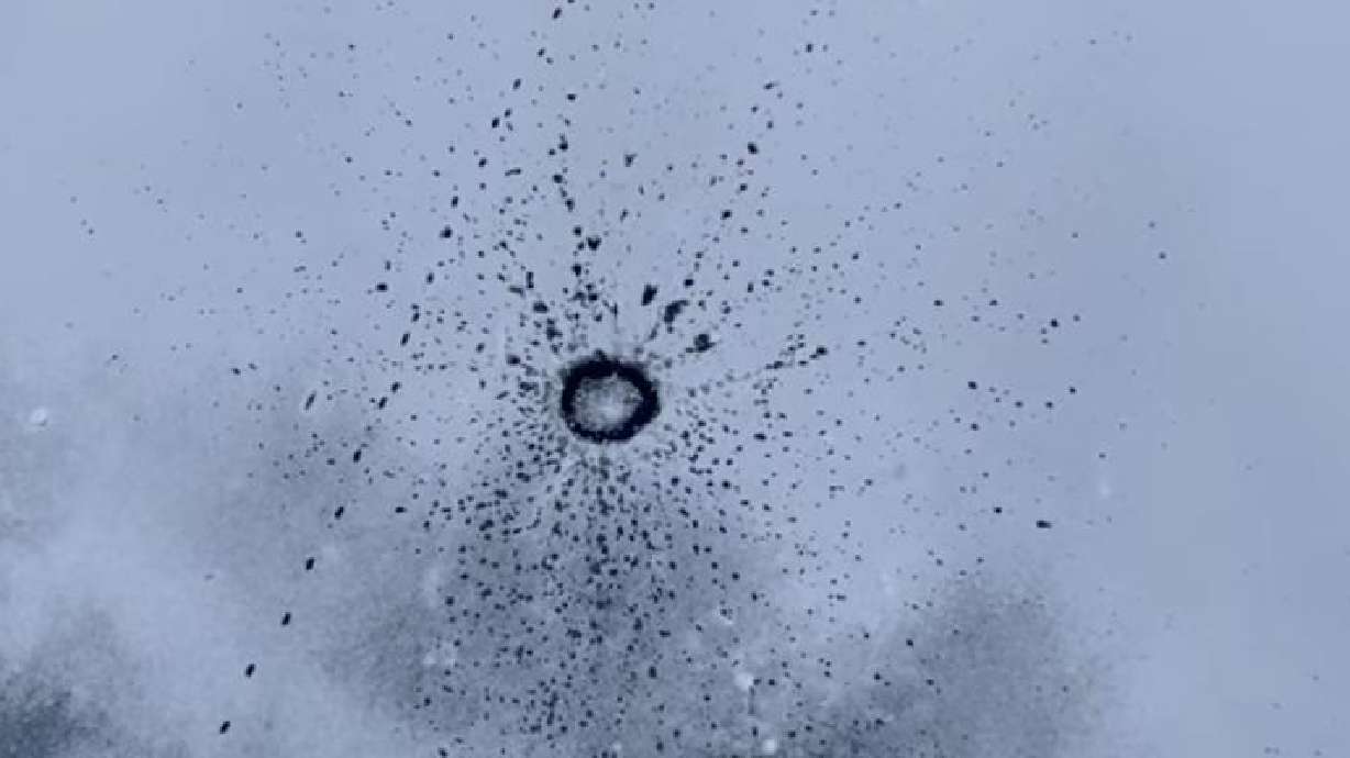 A chunk of ice thrown from a bridge made a unique pattern on the frozen river in Thompson Falls, Montana, Jan. 10.