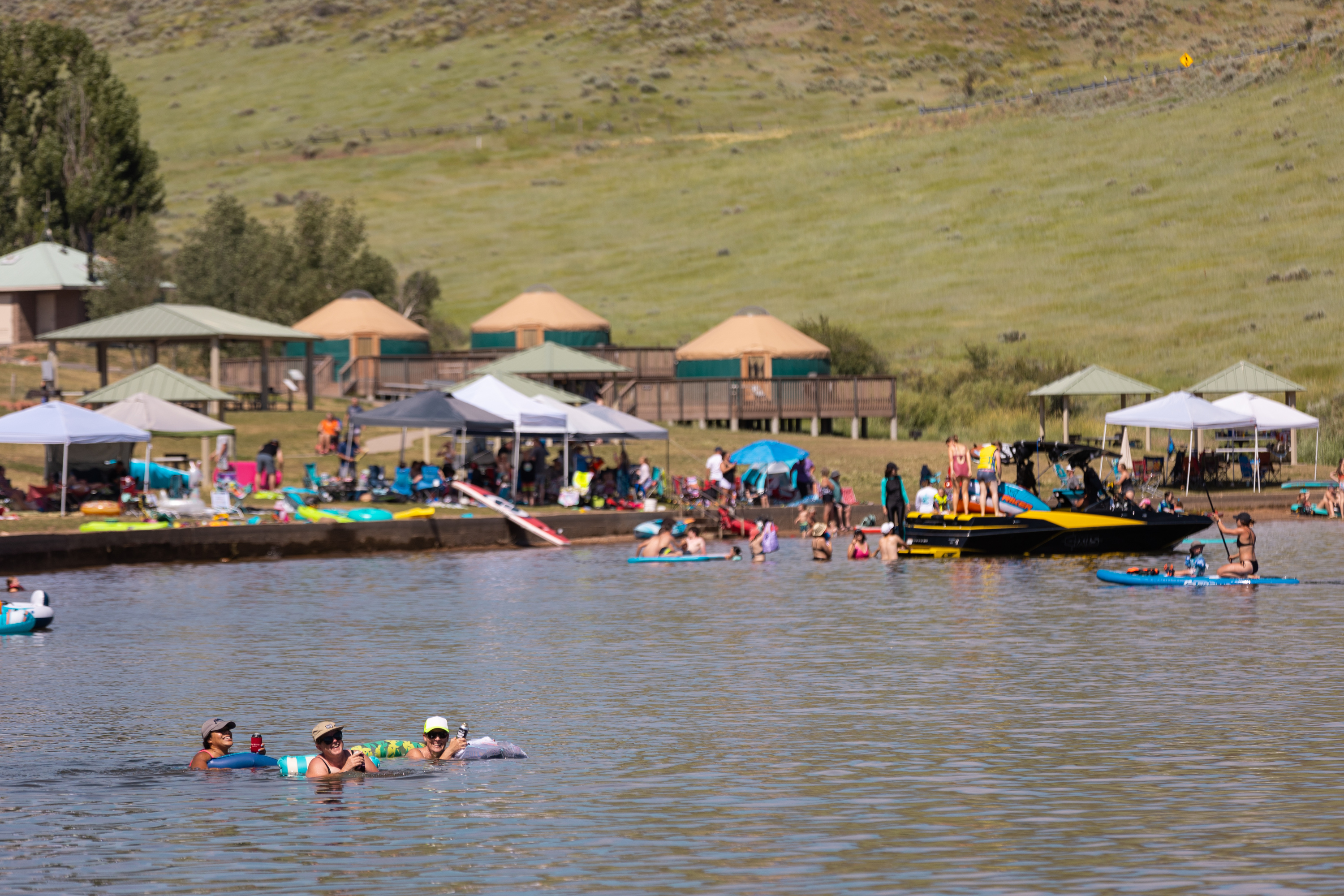 People enjoy being in the water on a hot day at East Canyon State Park in Morgan on July 17, 2023. It was one of the many heavily visited state parks last year. In all, the parks generated a record-setting 12 million visitors in 2023.