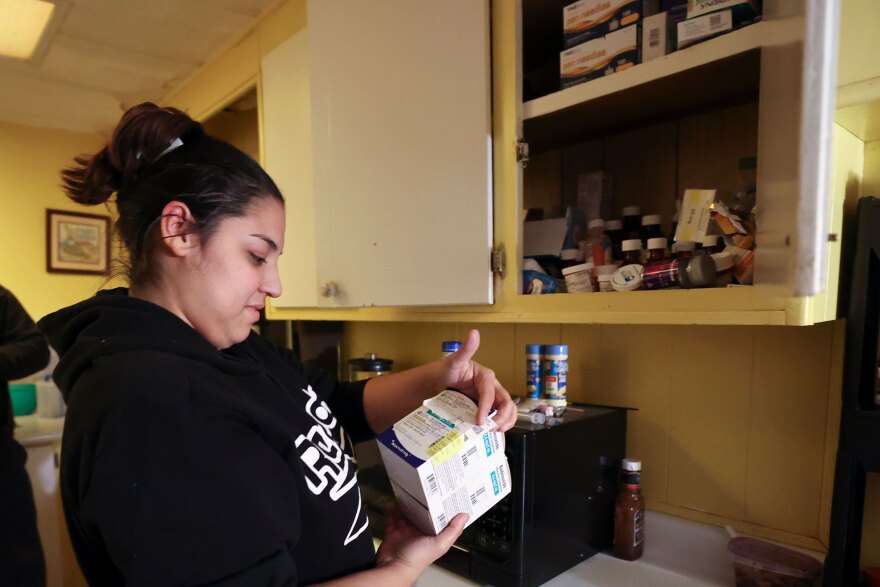 Rosa Mandujano shows a cupboard full of medicine related to her two children’s asthma at their home near the Salton Sea and Mecca, California, on Thursday, Dec. 14, 2023.
