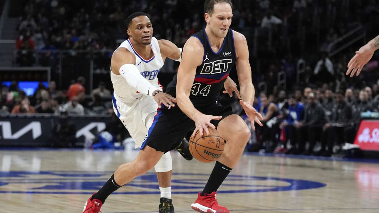 Detroit Pistons forward Bojan Bogdanovic (44) drives on Los Angeles Clippers guard Russell Westbrook (0) in the first half of an NBA basketball game in Detroit, Friday, Feb. 2, 2024.