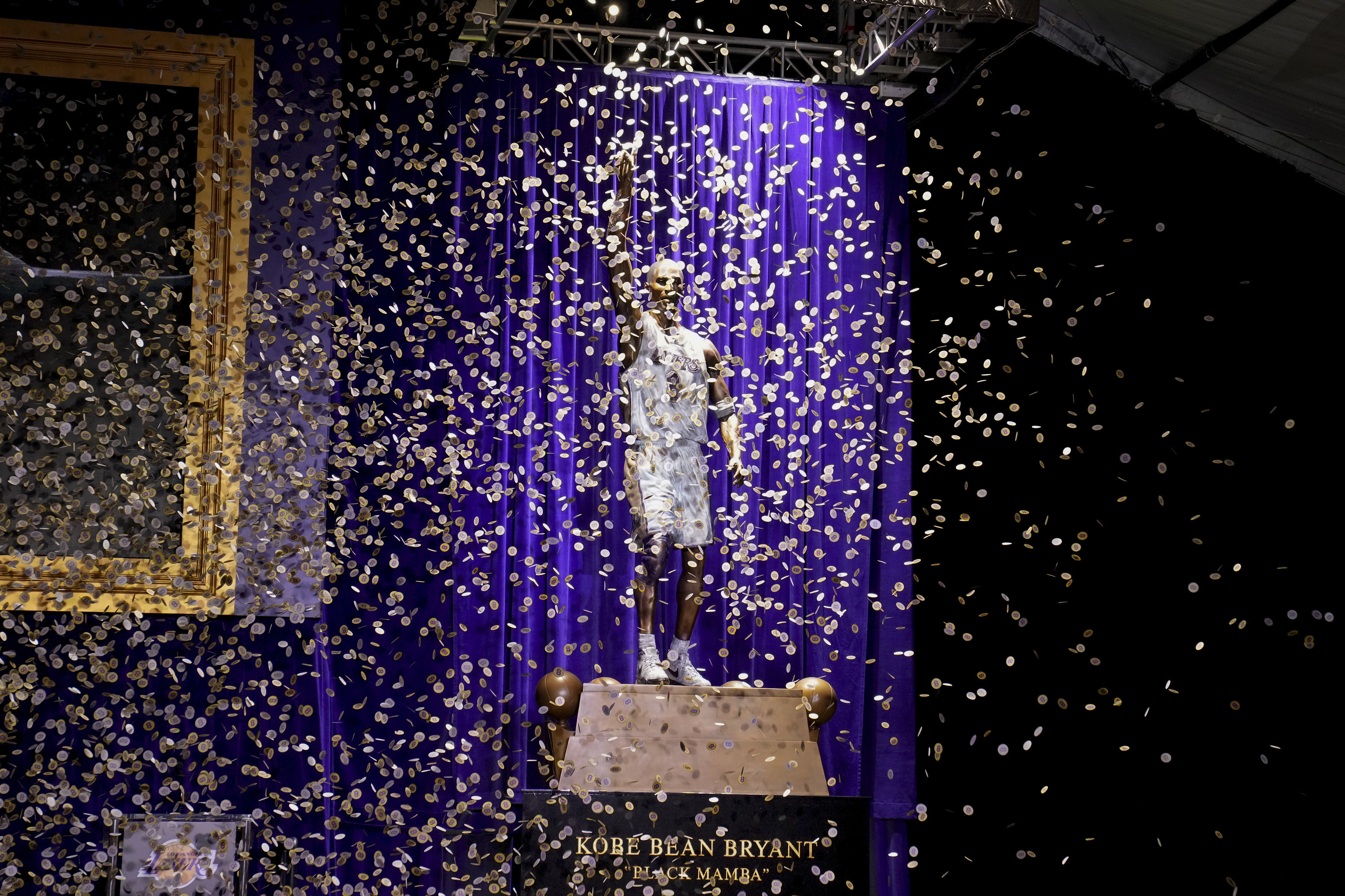 Confetti is released during unveiling of a statue in honor of former Los Angeles Lakers guard Kobe Bryant outside the NBA basketball team's arena, Thursday, Feb. 8, 2024, in Los Angeles. 