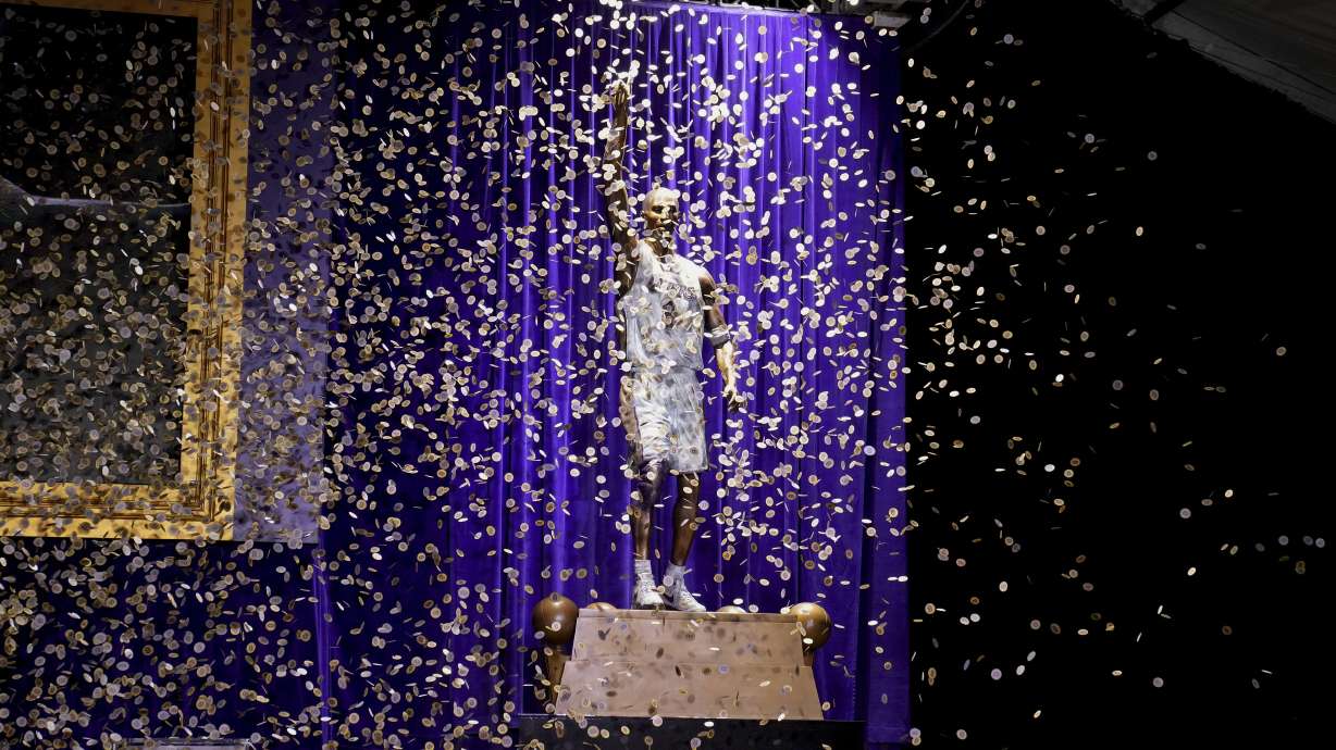 Confetti is released during unveiling of a statue in honor of former Los Angeles Lakers guard Kobe Bryant outside the NBA basketball team's arena, Thursday, Feb. 8, 2024, in Los Angeles.