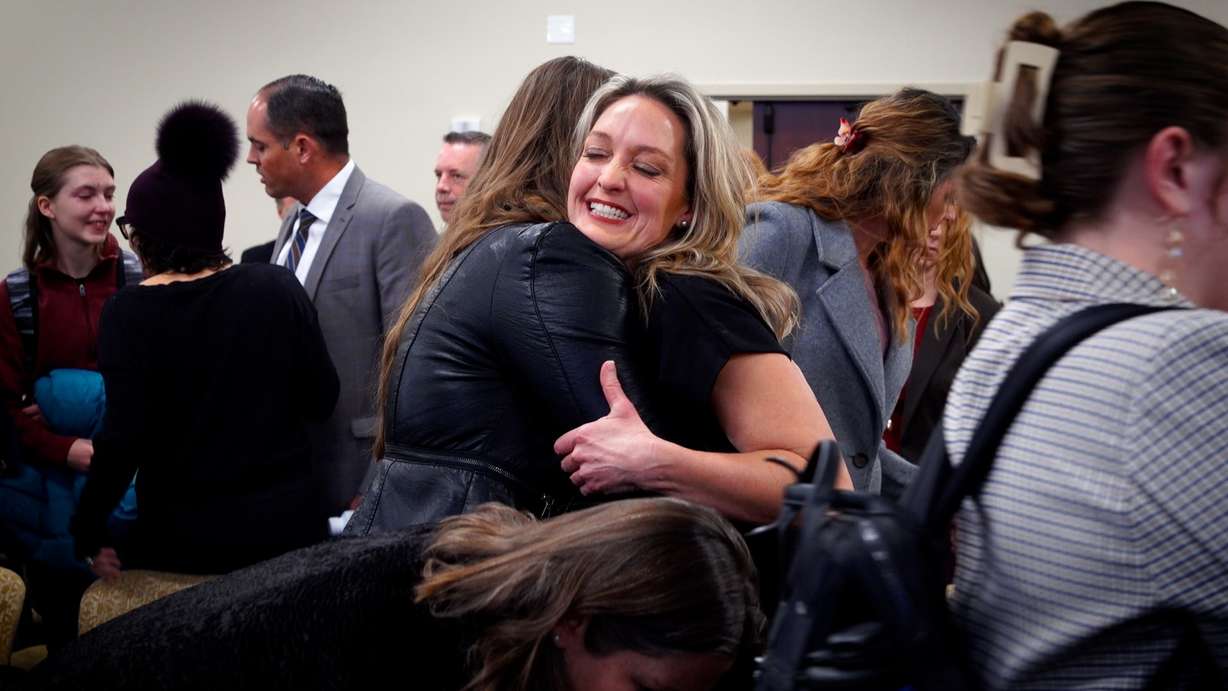 Leah Moses hugs a supporter after a legislative panel advanced a reform bill focused on Utah’s family court system Thursday.
