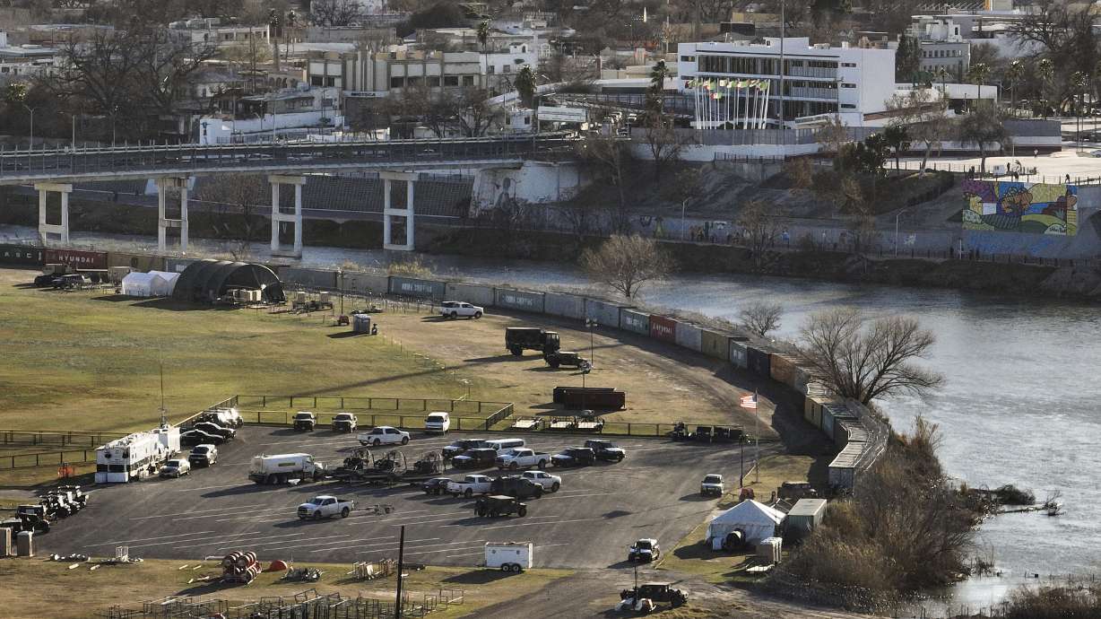 Shipping containers and concertina wire line the banks of the Rio Grande, in Shelby Park in Eagle Pass, Texas, across the border from Piedras Negras, Mexico, Sunday, Feb. 4.