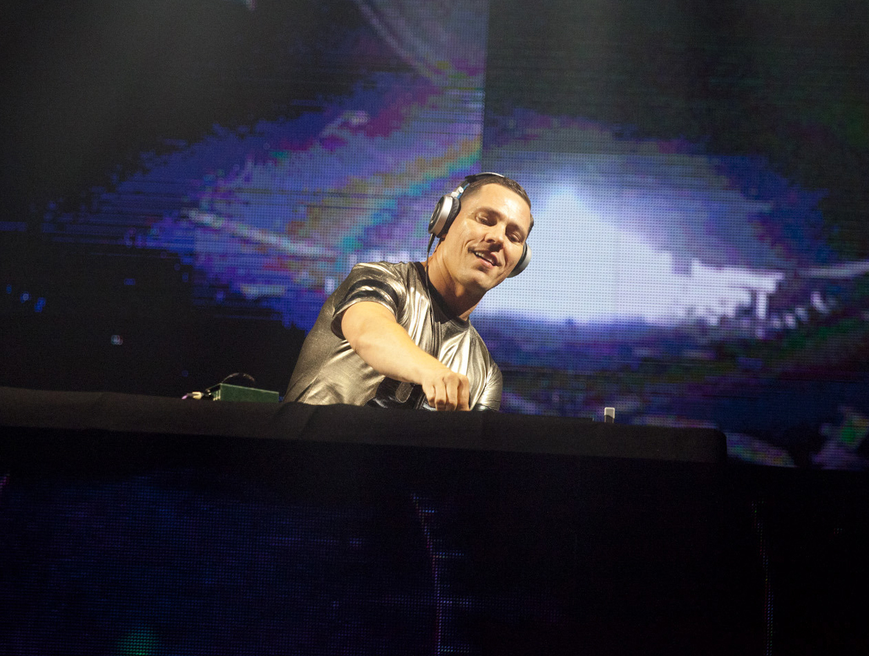 FILE - DJ Tiesto performs during a concert at the Presidente Festival at the Olympic Stadium in Santo Domingo, Dominican Republic on Oct. 3, 2014. Dutch music producer DJ Tiësto has withdrawn from performing at Sunday's Super Bowl due to an undisclosed family matter. The Dutchman wrote on social media that “it was a tough decision to miss the game, but family always comes first.”