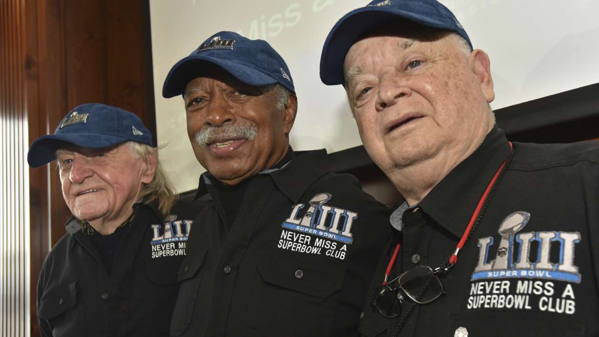 FILE - Members of the Never Miss a Super Bowl Club, from the left, Tom Henschel, Gregory Eaton, and Don Crisman pose for a group photograph during a welcome luncheon, in Atlanta, Friday, Feb. 1, 2019. As long as they still have each other, they're still going to go to every Super Bowl. That's the sentiment shared by the three friends who say they are the final fans who can claim membership in the exclusive “never missed a Super Bowl” club. And they're back again for number 58 — Super Bowl 58 — this year.