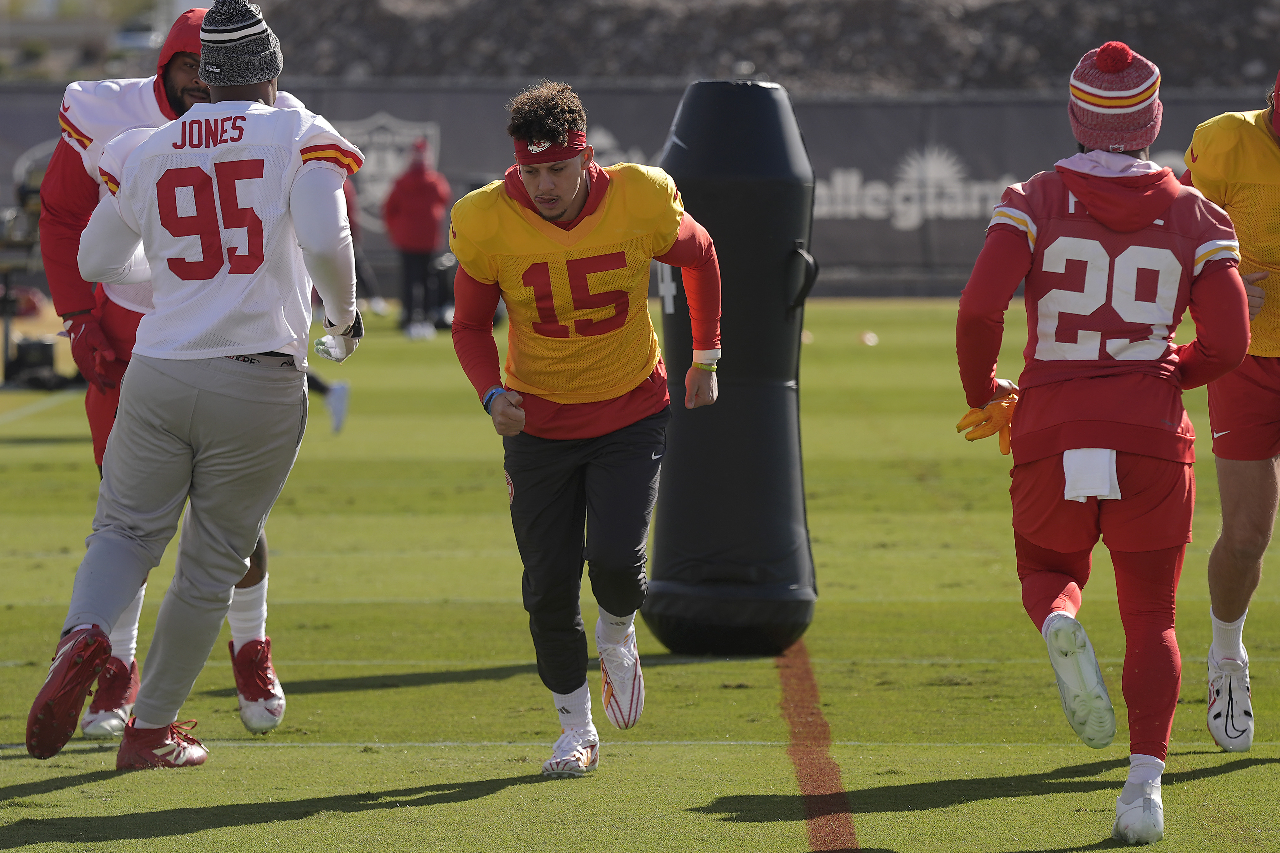 Kansas City Chiefs quarterback Patrick Mahomes (15) runs with teammates during practice Wednesday, Feb. 7, 2024 in Henderson, Nev. The Chiefs are scheduled to play the San Francisco 49ers in the NFL's Super Bowl 58 football game Sunday in Las Vegas. 