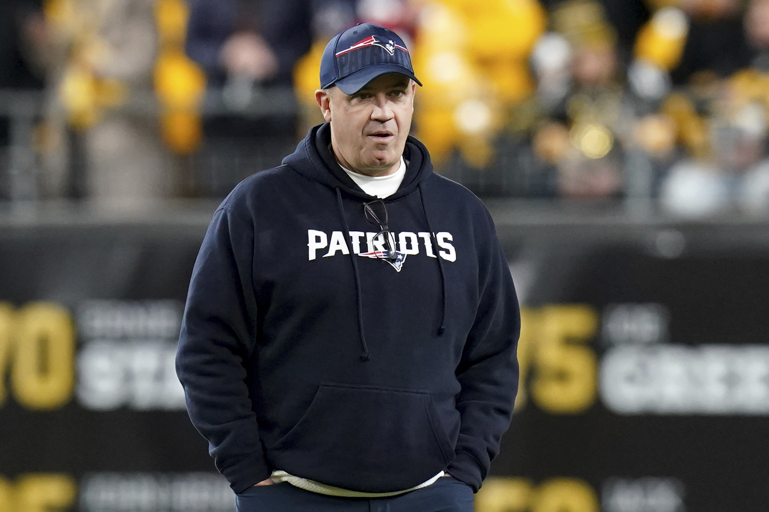 FILE - New England Patriots offensive coordinator Bill O'Brien watches warmups for the team's NFL football game against the Pittsburgh Steelers on Dec. 7, 2023, in Pittsburgh. Ohio State is hiring O'Brien as its offensive coordinator, a person with direct knowledge of the decision told The Associated Press on Thursday night, Jan. 18, 2024. The person spoke on condition of anonymity because the hire still needed university approval, but an announcement was expected as soon as Friday. 