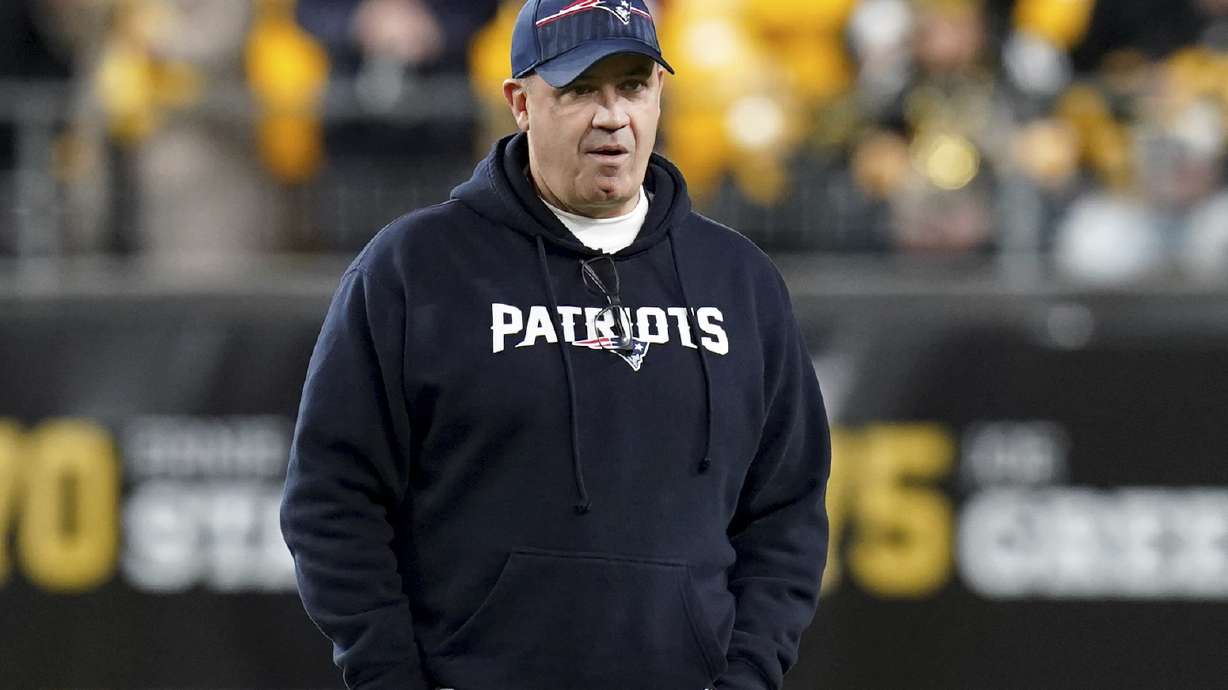 FILE - New England Patriots offensive coordinator Bill O'Brien watches warmups for the team's NFL football game against the Pittsburgh Steelers on Dec. 7, 2023, in Pittsburgh. Ohio State is hiring O'Brien as its offensive coordinator, a person with direct knowledge of the decision told The Associated Press on Thursday night, Jan. 18, 2024. The person spoke on condition of anonymity because the hire still needed university approval, but an announcement was expected as soon as Friday.