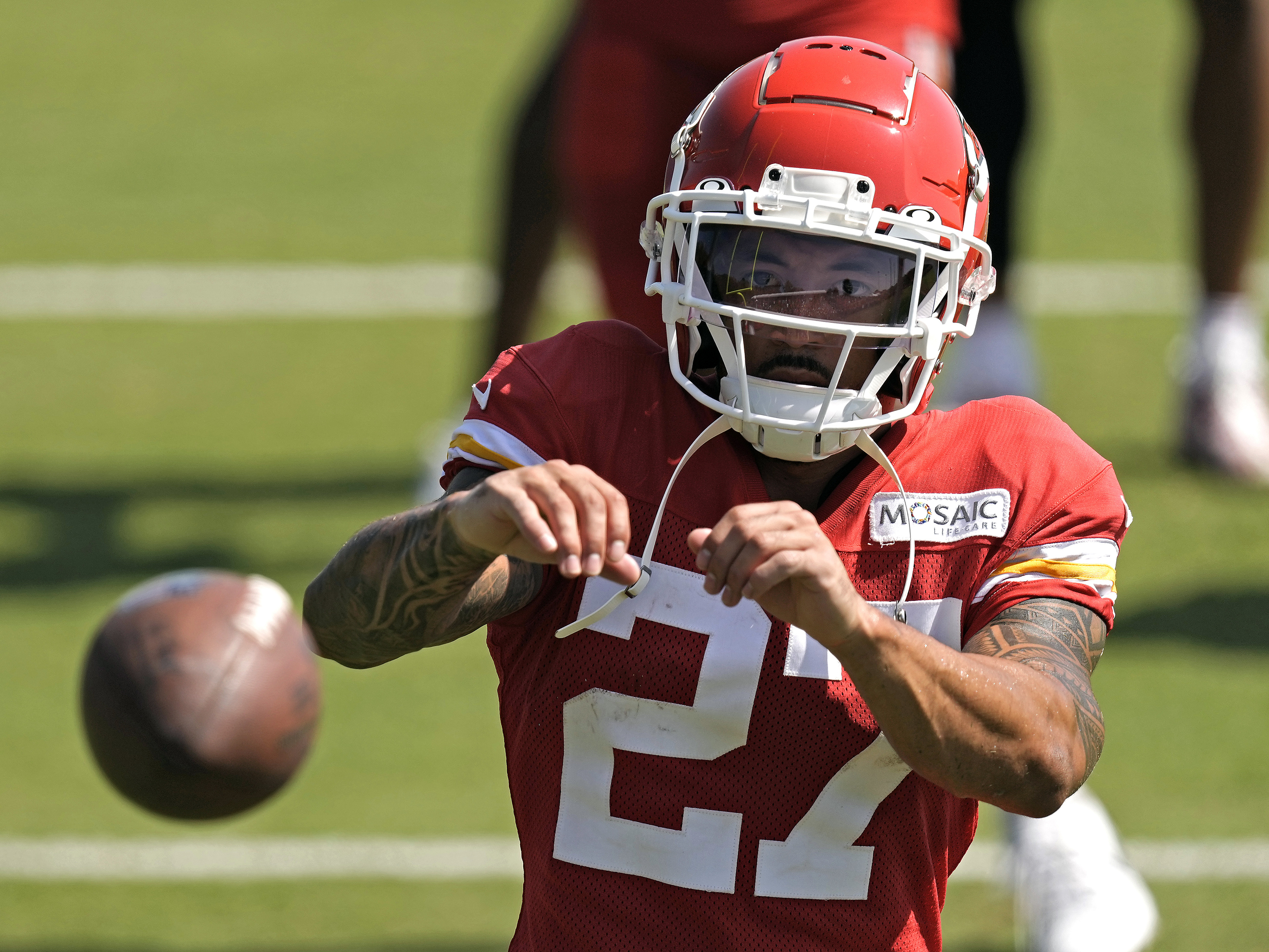 FILE - Kansas City Chiefs wide receiver Nikko Remigio catches a ball after NFL football training camp July 28, 2023, in St. Joseph, Mo. Historically, Asian Americans and have been stereotyped as more brains than brawn or "foreigners" not fit for some American sports. Many current and former athletes of Asian American as well as Pacific Islander heritage agreed that such misconceptions have mostly faded. Increasingly, major athletes have been able to amplify their culture on a public stage and be embraced by the public. 