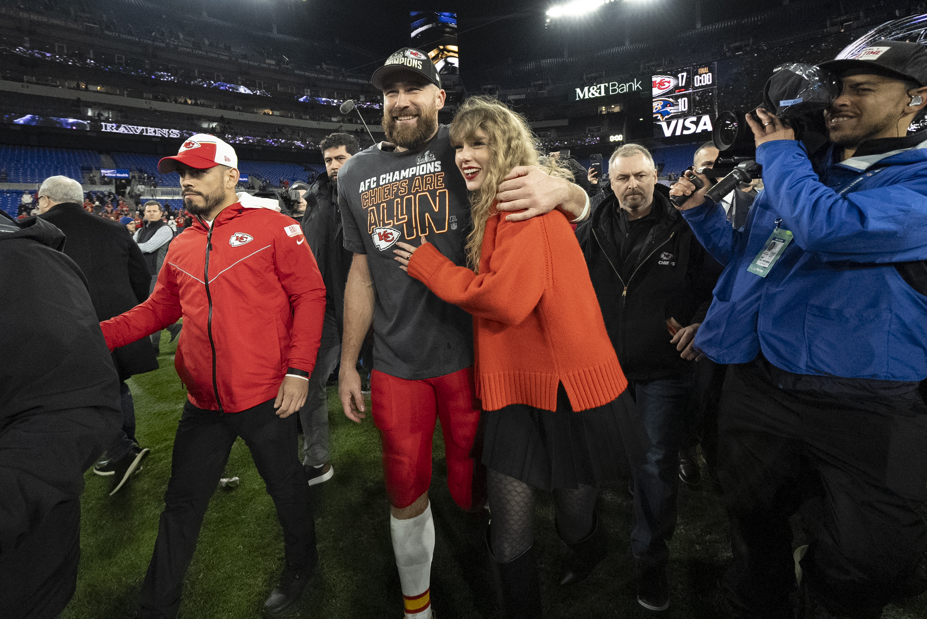 FILE - Kansas City Chiefs tight end Travis Kelce walks with Taylor Swift following the AFC Championship NFL football game between the Baltimore Ravens and the Kansas City Chiefs in Baltimore on Jan. 28, 2024. The Chiefs won 17-10. 