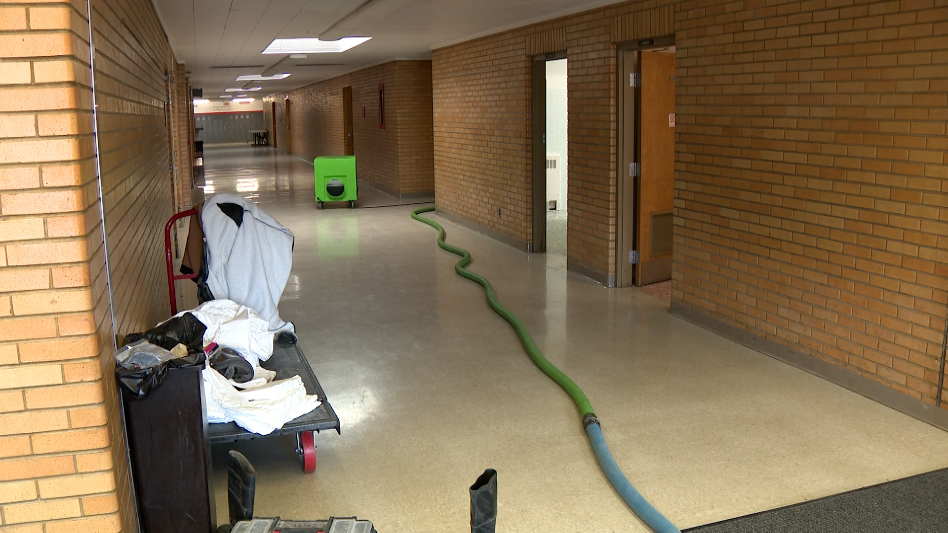 Hoses were all over the school hallways Friday as crews cleaned up the mess and smell at Bear River Middle School in Garland.