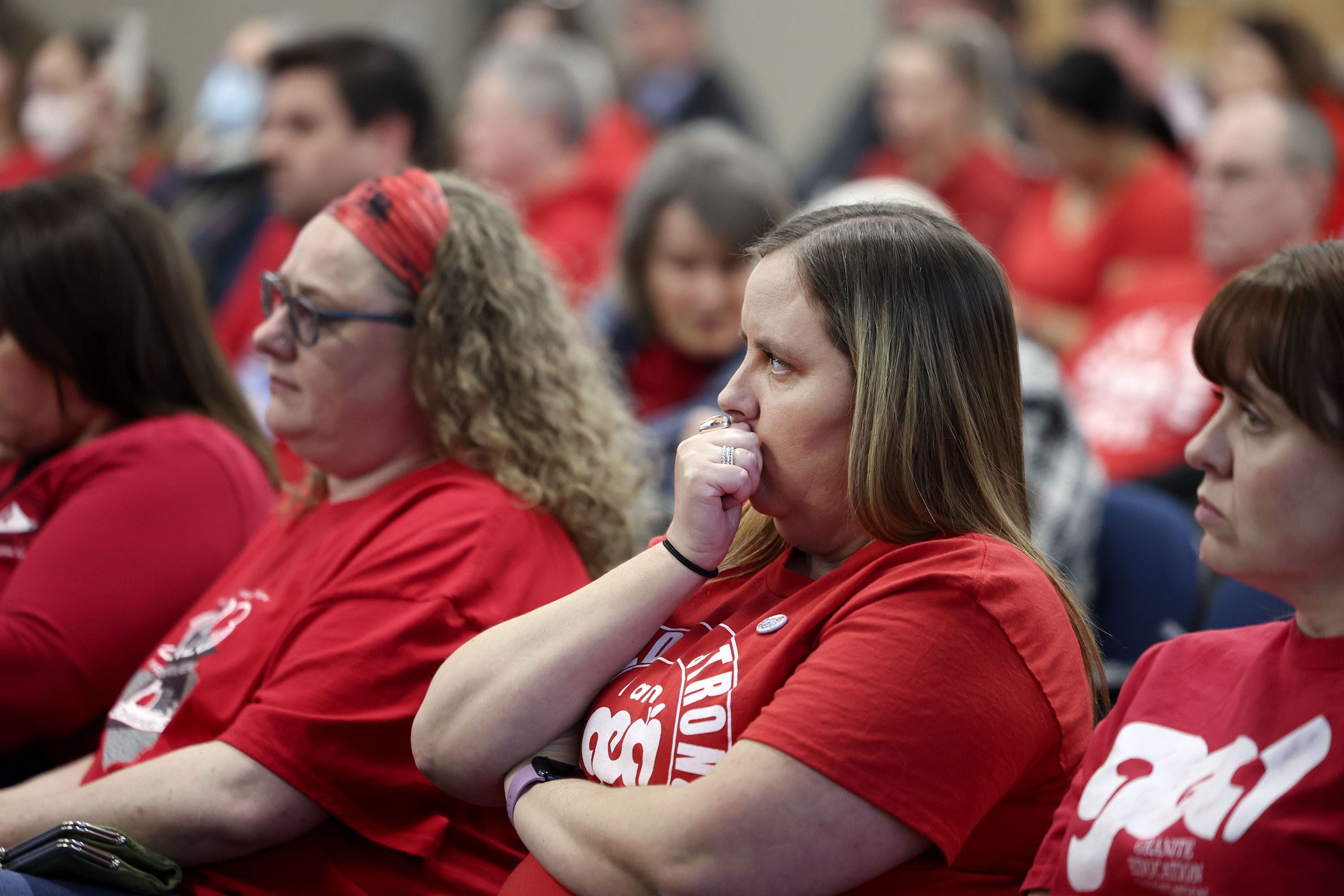 Attendees listen during a special meeting to discuss a resolution condemning the actions of Utah State Board of Education member Natalie Cline at the Granite School District in Salt Lake City on Friday.