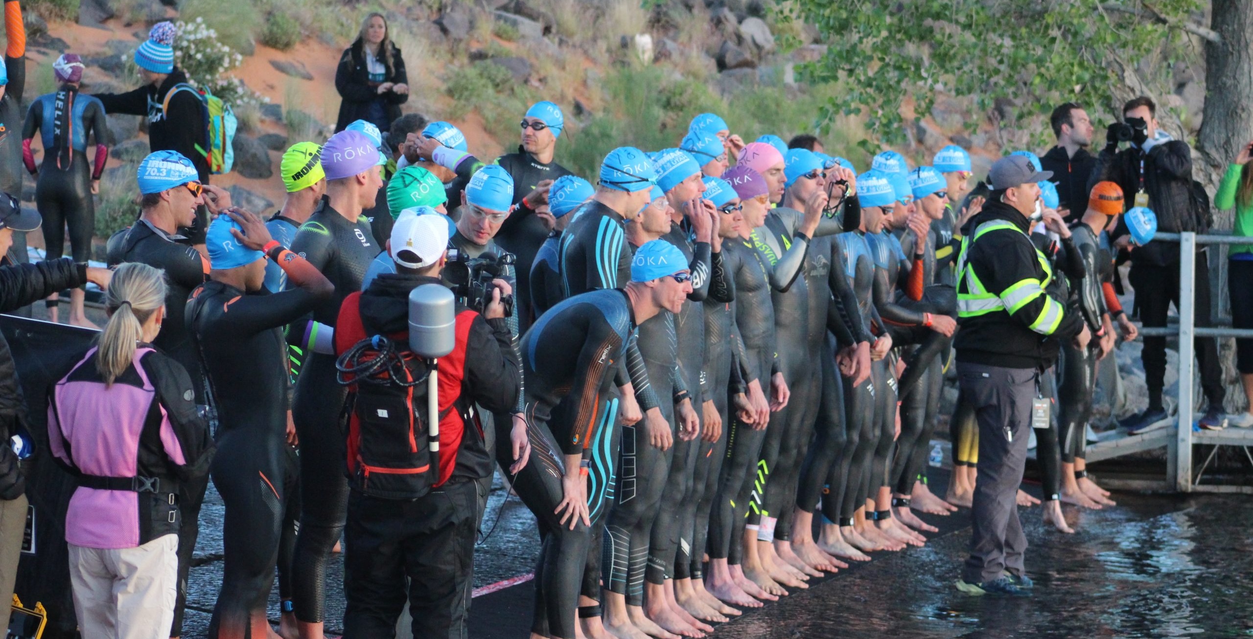 The men’s professional field at the Ironman 70.3 North American Championship lines up at the start line at Sand Hollow Reservoir, Hurricane, Washington County, May 6, 2023 