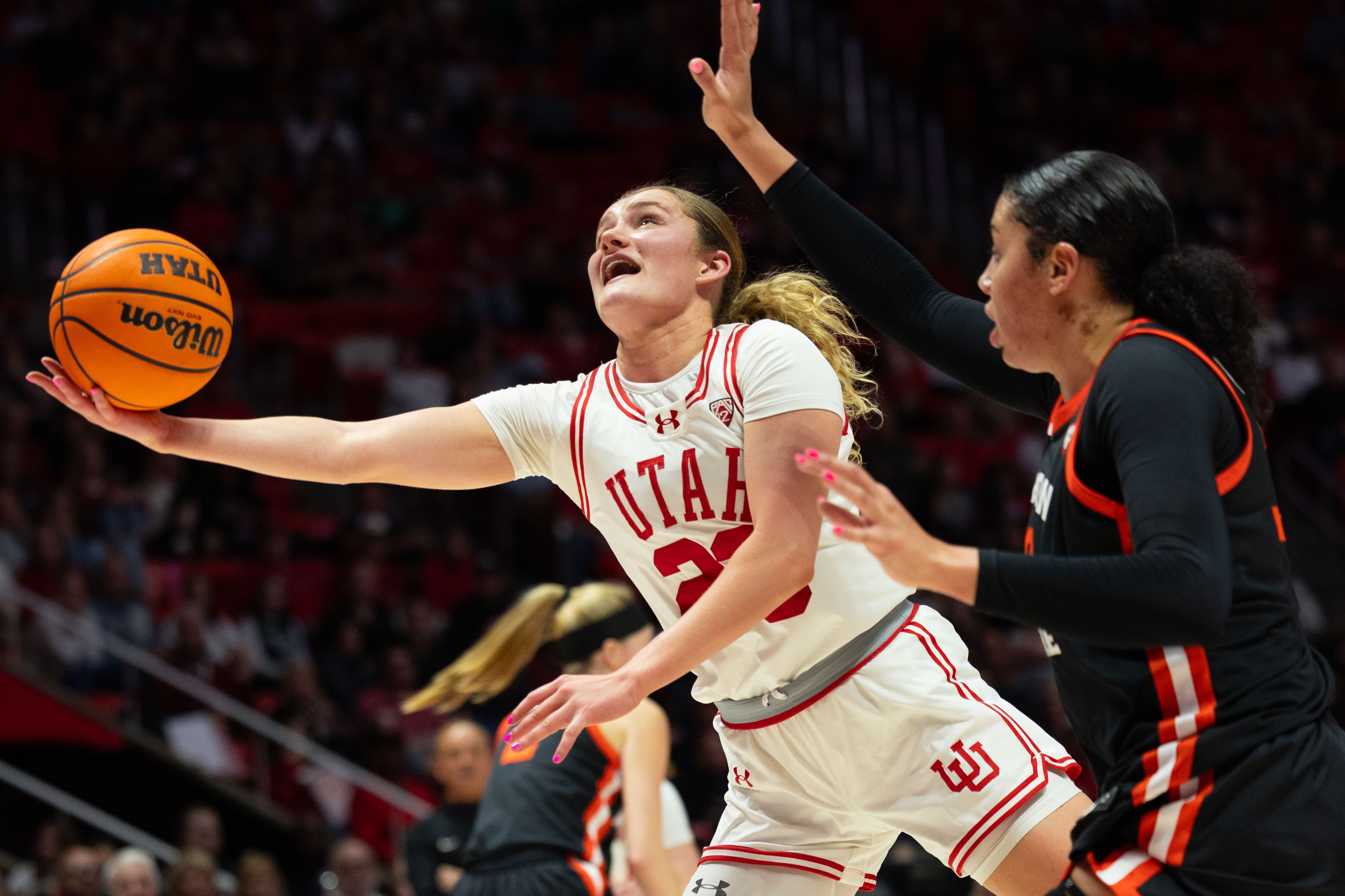 Utah Utes guard Matyson Wilke (23) shoots the ball with Oregon State Beavers forward Timea Gardiner (30) on defense during the women’s college basketball game between the Utah Utes and the Oregon State Beavers at the Jon M. Huntsman Center in Salt Lake City on Friday, Feb. 9, 2024.