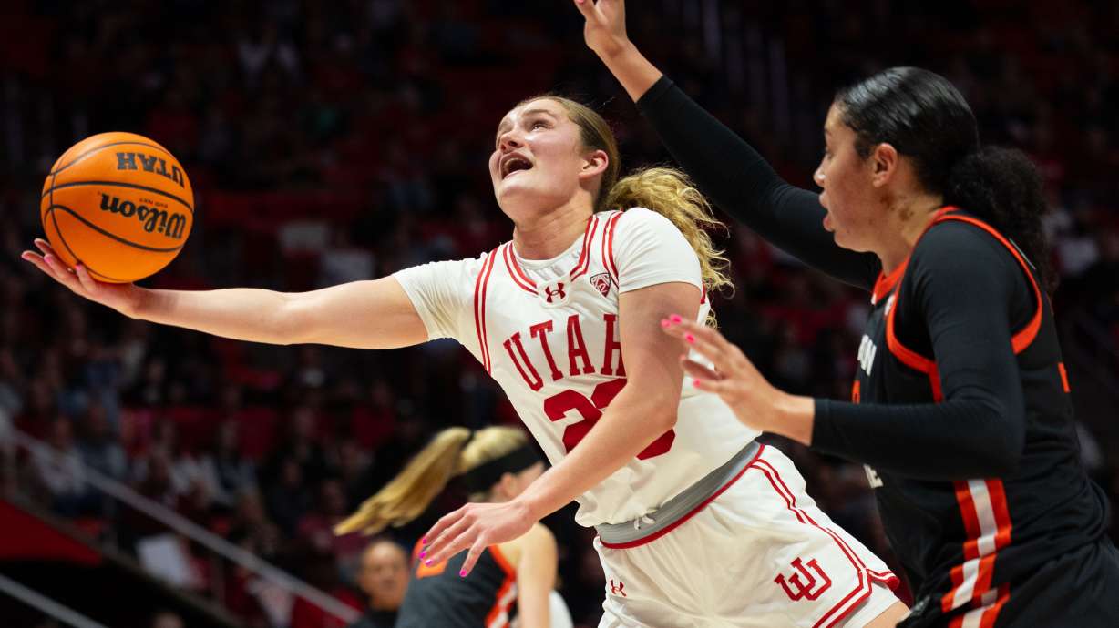 Utah Utes guard Matyson Wilke (23) shoots the ball with Oregon State Beavers forward Timea Gardiner (30) on defense during the women’s college basketball game between the Utah Utes and the Oregon State Beavers at the Jon M. Huntsman Center in Salt Lake City on Friday, Feb. 9, 2024.