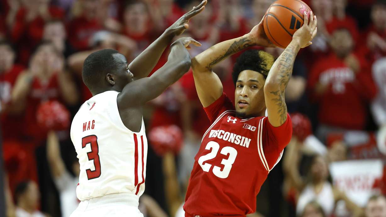 Rutgers forward Mawot Mag (3) defends against Wisconsin guard Chucky Hepburn (23) during the first half of an NCAA college basketball game, Saturday, Feb. 10, 2024, in Piscataway, N.J.