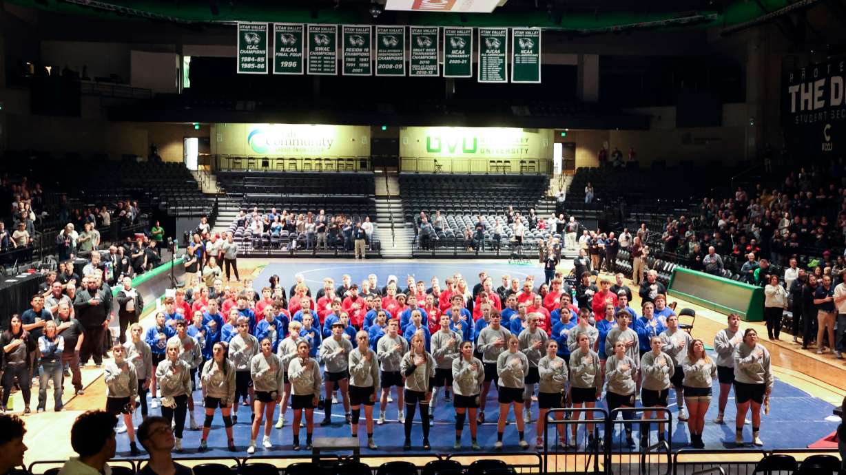Wrestlers listen to "The Star-Spangled Banner" before competing in the Ross Brunson Utah All-Star Dual at the UCCU Events Center in Orem, on Tuesday, Jan. 9, 2024.