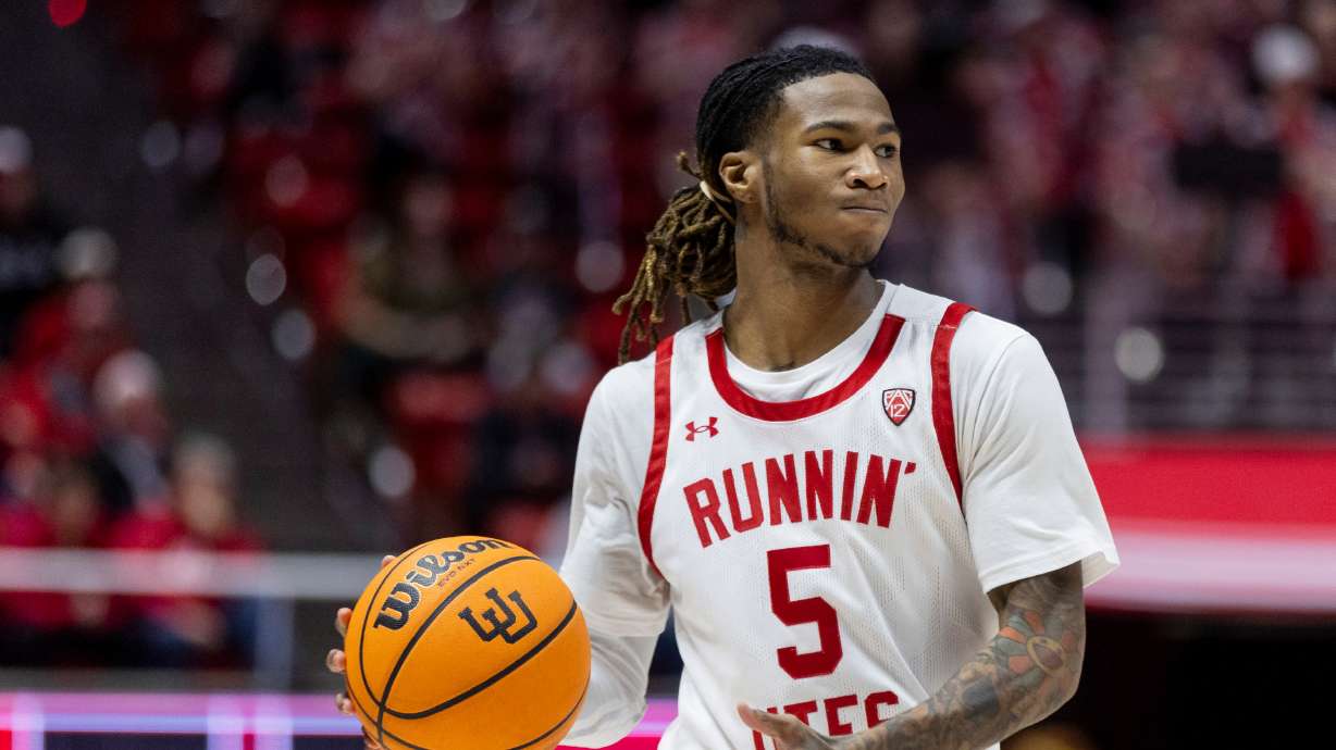 Utah Utes guard Deivon Smith (5) looks to pass the ball during a game against the Arizona Sun Devils at the Huntsman Center in Salt Lake City on Saturday, Feb. 10, 2023.