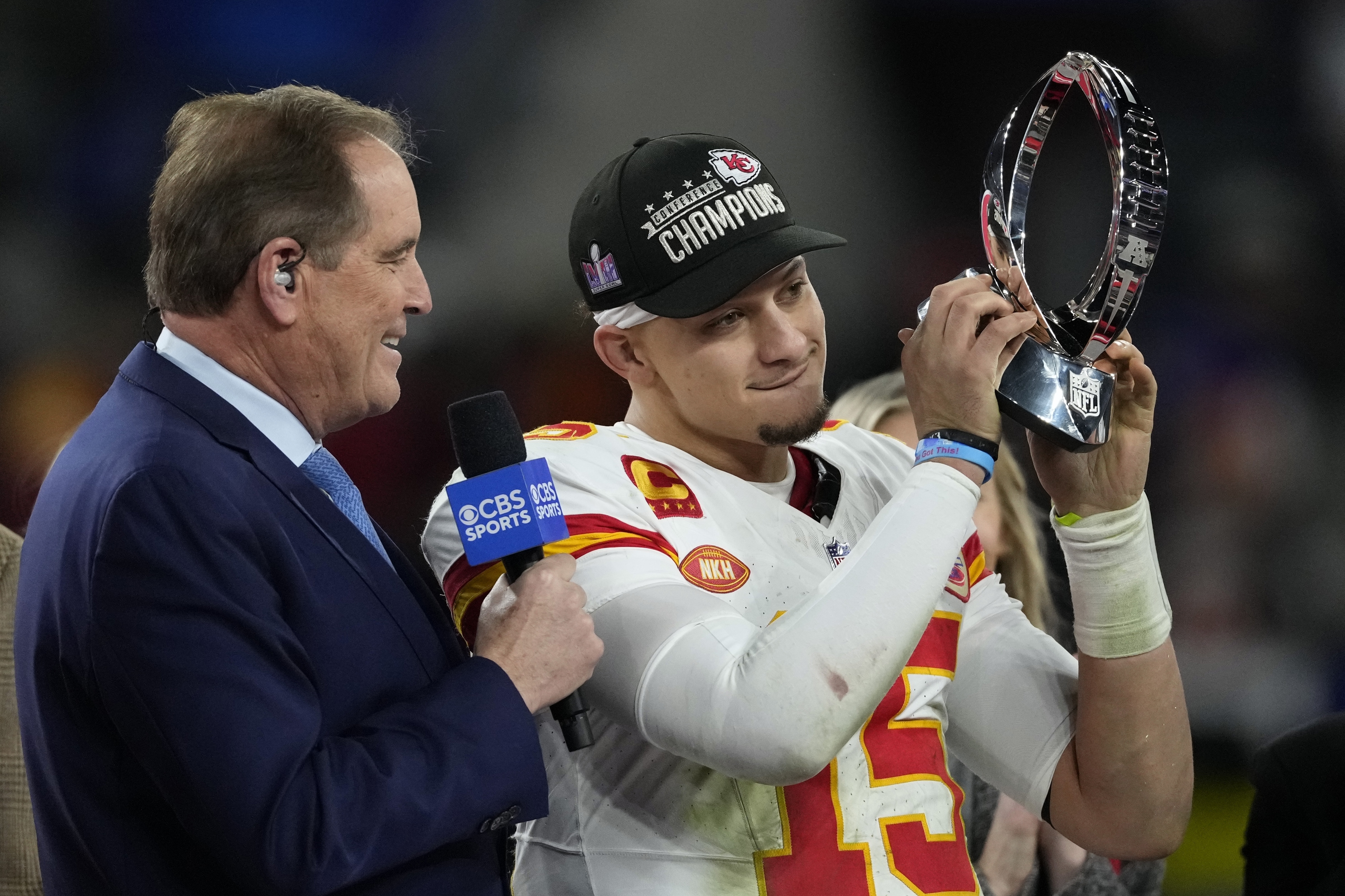 Kansas City Chiefs quarterback Patrick Mahomes (15) holds up the Lamar Hunt Trophy after the AFC Championship NFL football game against the Baltimore Ravens, Sunday, Jan. 28, 2024, in Baltimore. The Chiefs won 17-10. 