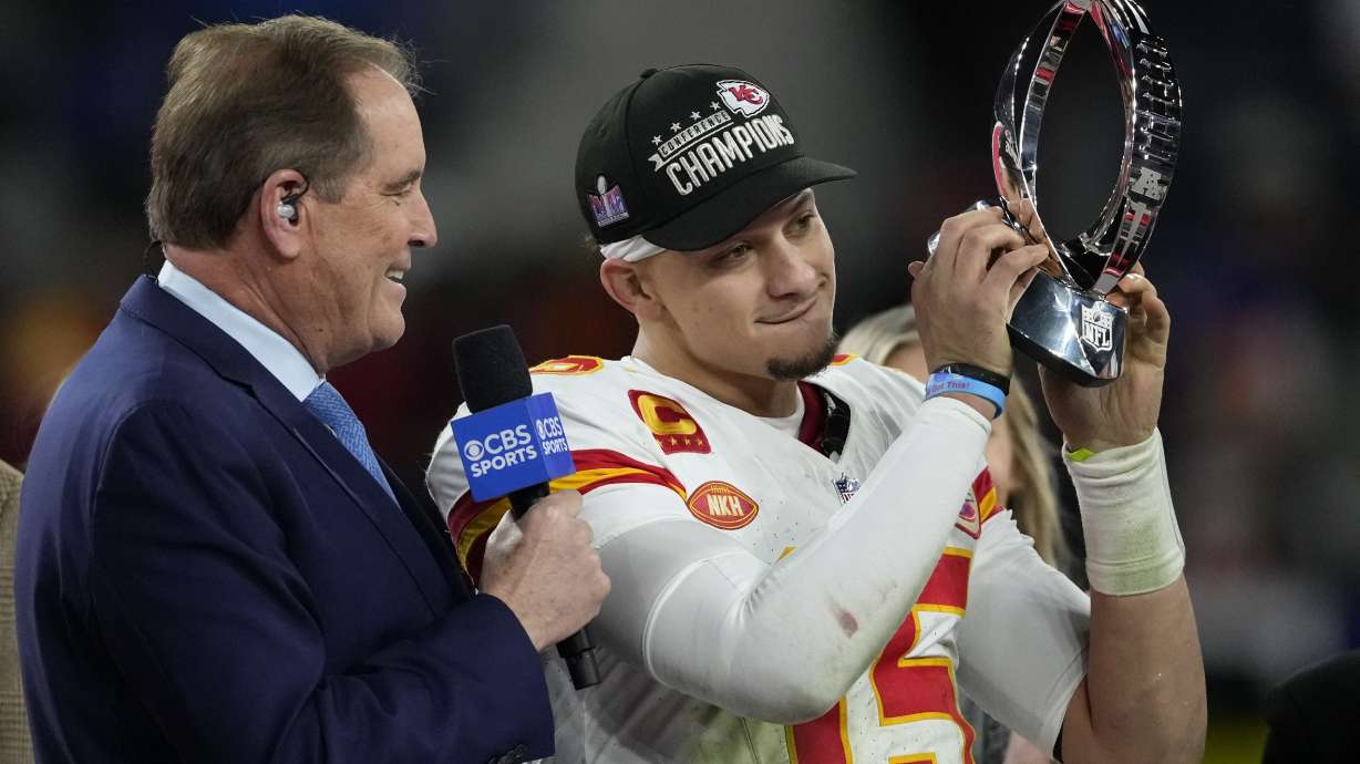 Kansas City Chiefs quarterback Patrick Mahomes (15) holds up the Lamar Hunt Trophy after the AFC Championship NFL football game against the Baltimore Ravens, Sunday, Jan. 28, 2024, in Baltimore. The Chiefs won 17-10.