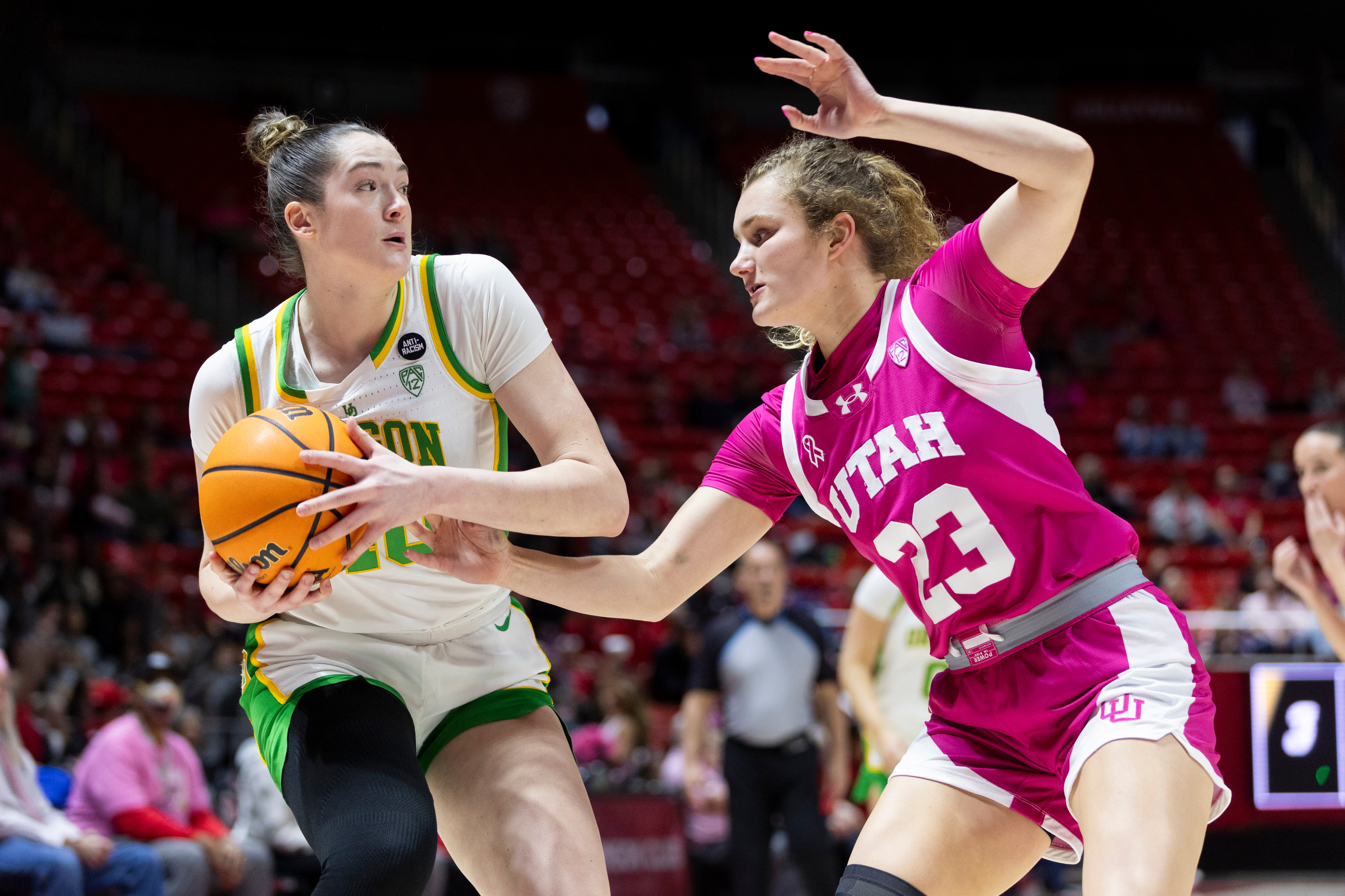 Utah Utes guard Matyson Wilke (23) defends against Oregon Ducks forward Grace VanSlooten (40) during a game at the Huntsman Center in Salt Lake City on Saturday, Feb. 11, 2023.
