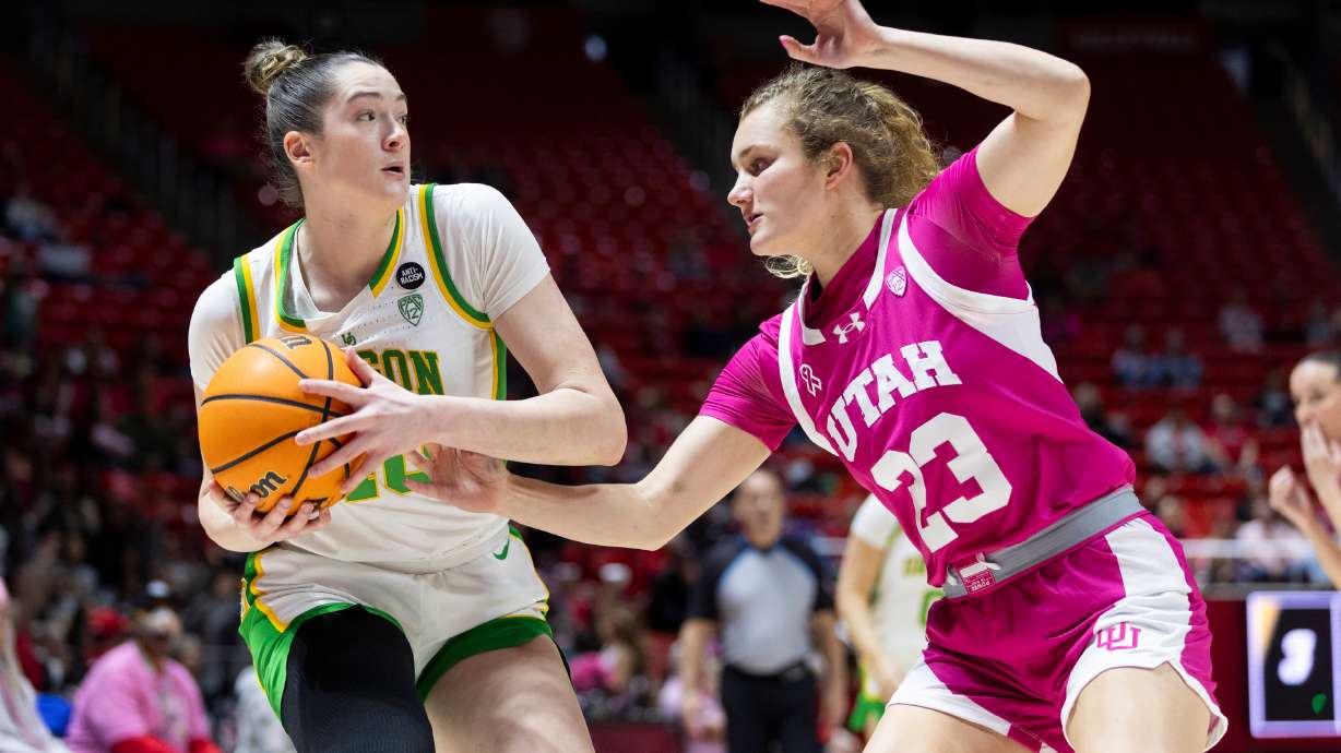 Utah Utes guard Matyson Wilke (23) defends against Oregon Ducks forward Grace VanSlooten (40) during a game at the Huntsman Center in Salt Lake City on Saturday, Feb. 11, 2023.
