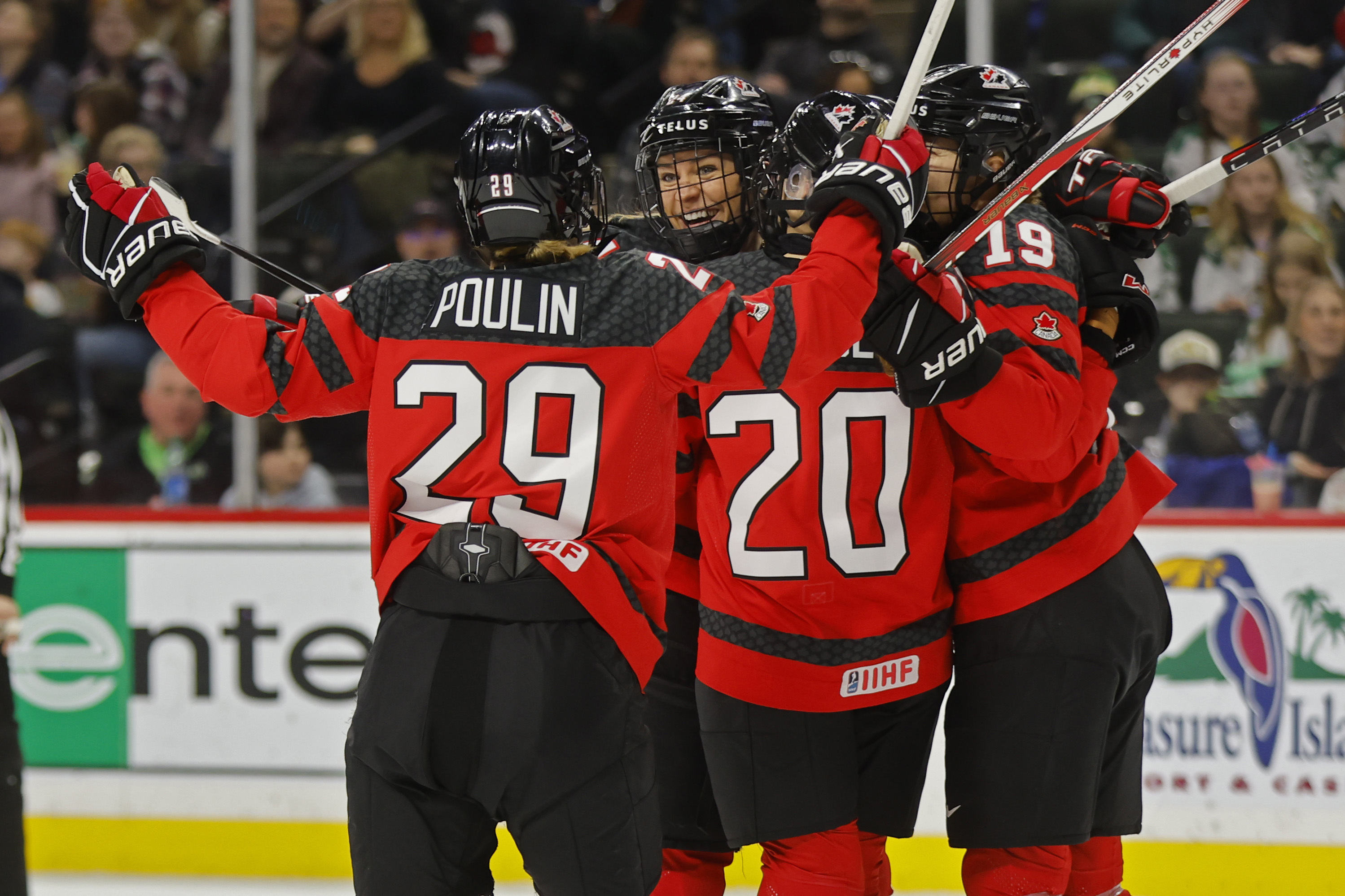 Canada players celebrates after a goal by Natalie Spooner (24) against the United States in the first period of a women's Rivalry Series hockey game Sunday, Feb. 11, 2024, in St. Paul, Minn.