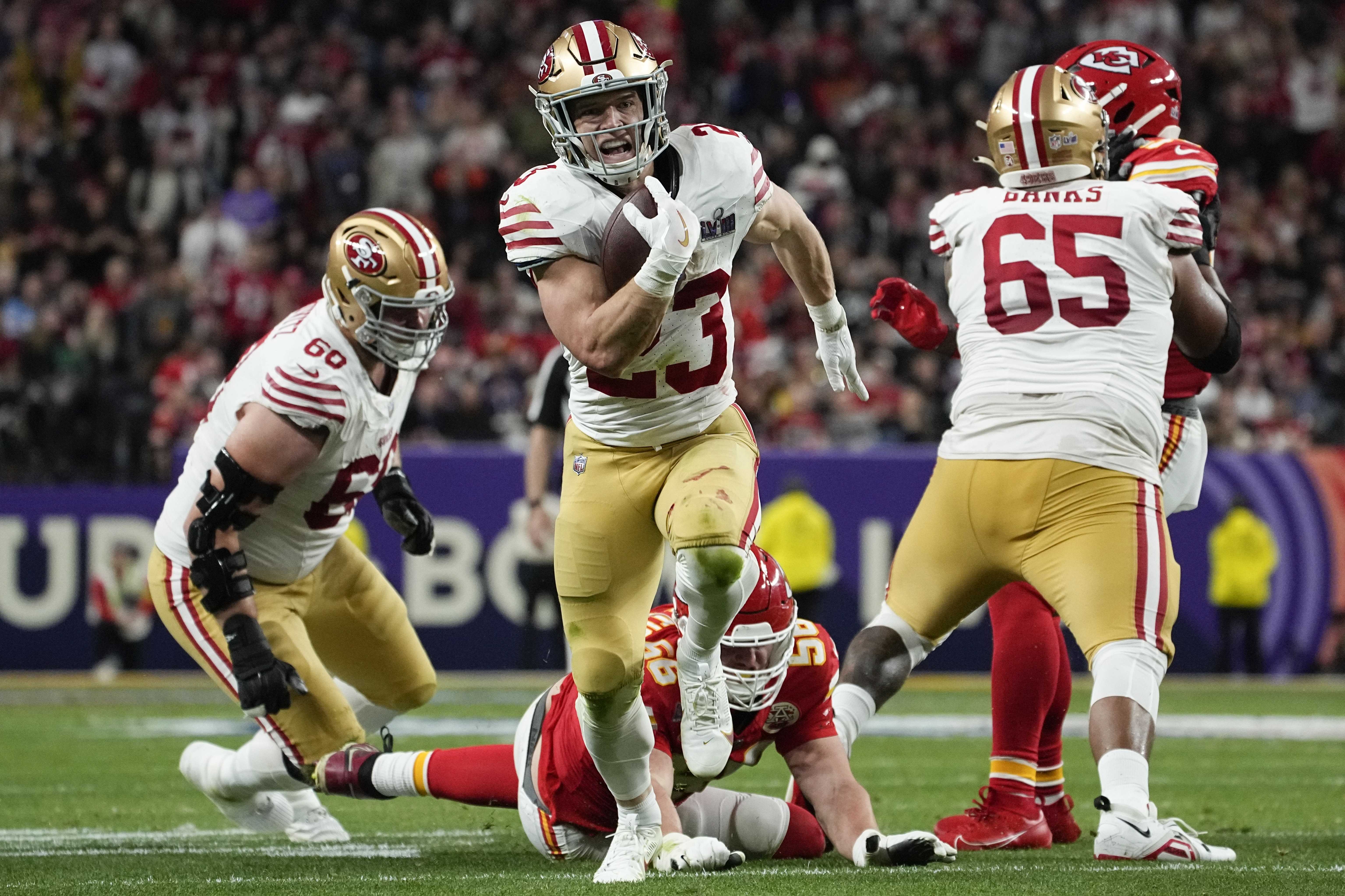 San Francisco 49ers running back Christian McCaffrey (23) runs into the end zone for a topuchdown against the Kansas City Chiefs during the first half of the NFL Super Bowl 58 football game Sunday, Feb. 11, 2024, in Las Vegas. 