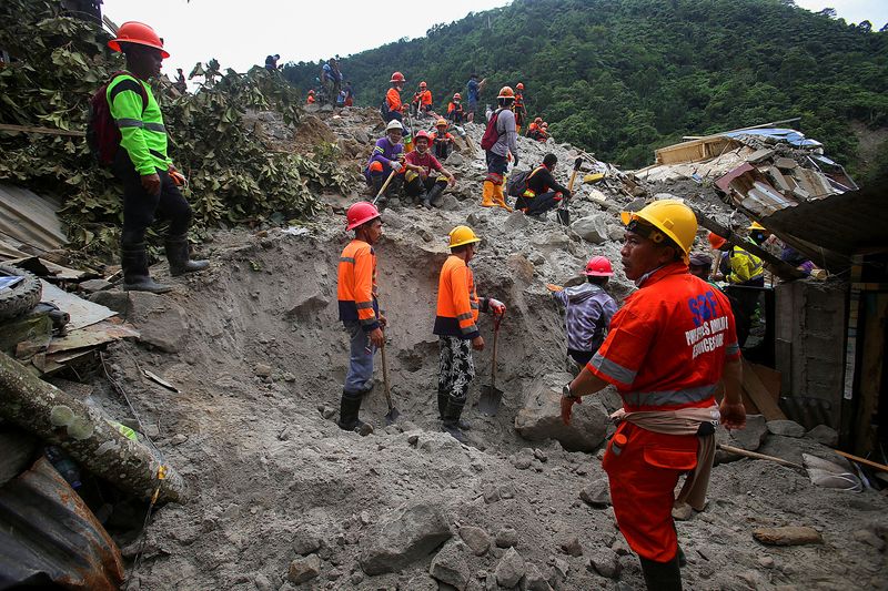 Search and rescue operations continue following a landslide in the village of Masara in the southern Philippines.