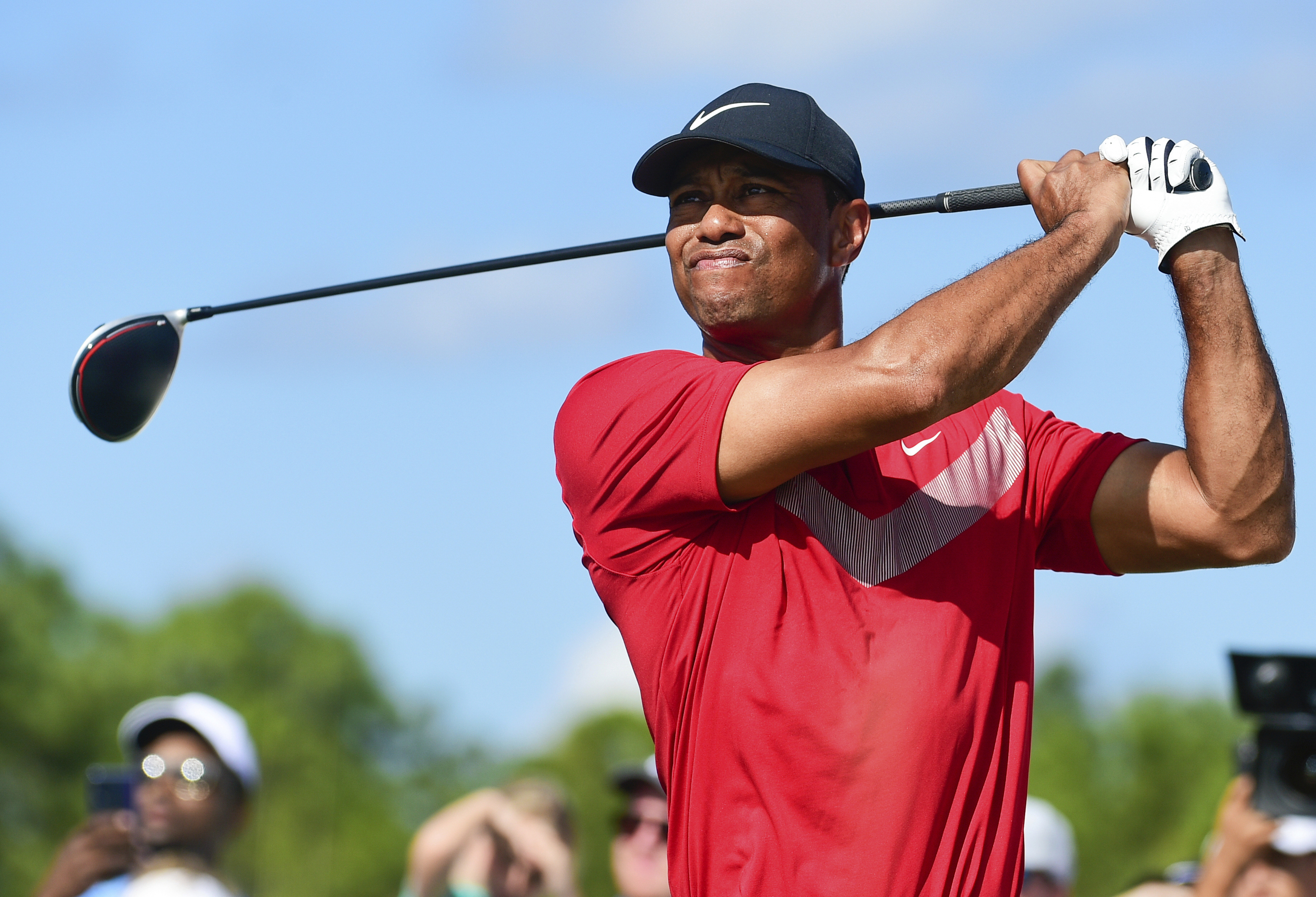 FILE - Tiger Woods follows his ball at the fourth tee during the last round of the Hero World Challenge at Albany Golf Club in Nassau, Bahamas, on Dec. 7, 2019. Woods is starting a new year with a new look. Just not a different color. Woods makes his 2024 debut this week in the Genesis Invitational at Riviera, a signature event on the PGA Tour in which he is the tournament host. The first order of business is unveiling what he referred to in December as the next “chapter.” 