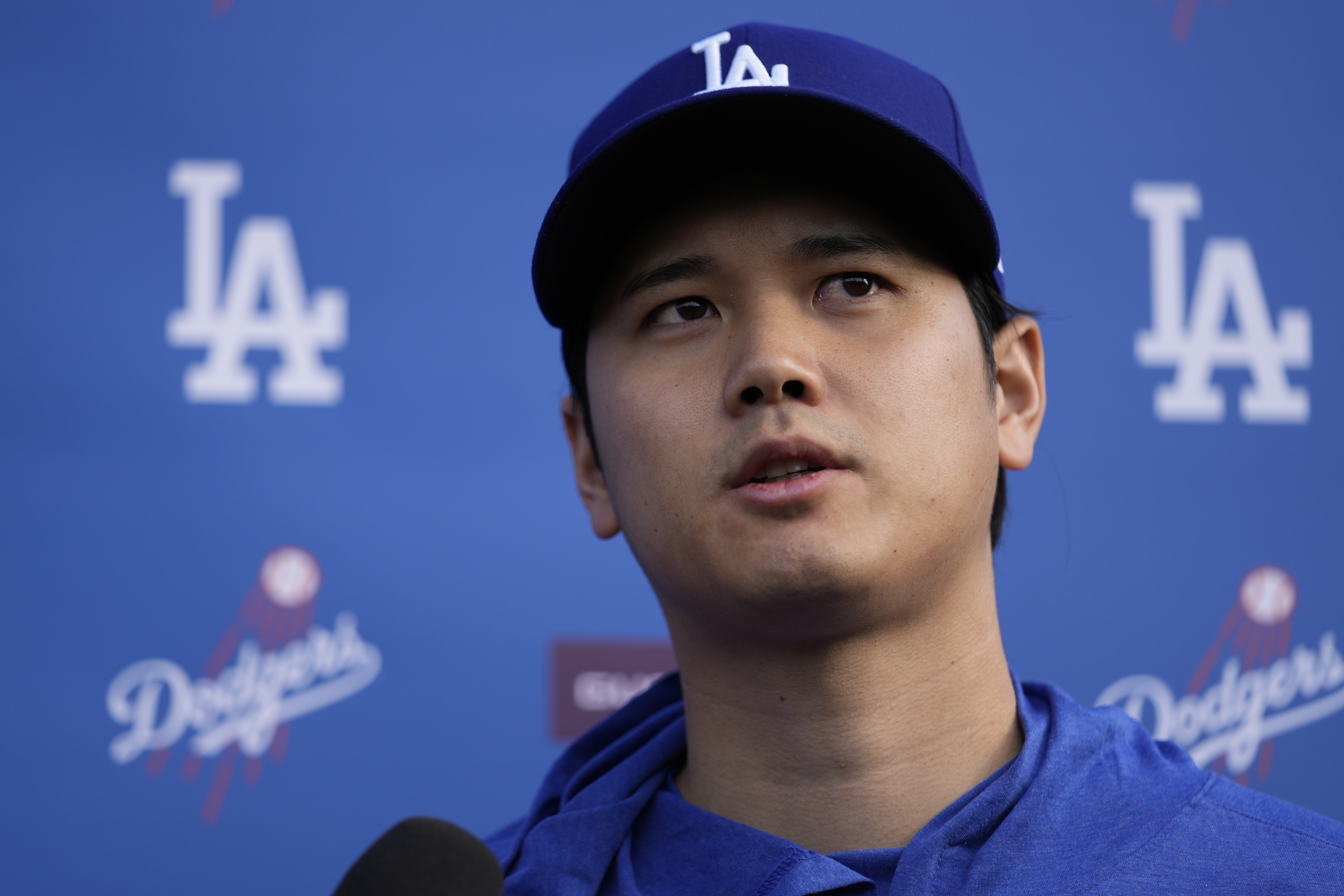 Los Angeles Dodgers' Shohei Ohtani speaks to media at Camelback Ranch in Phoenix, Friday, Feb. 9, 2024, on the first day of spring training baseball workouts for the Dodgers.