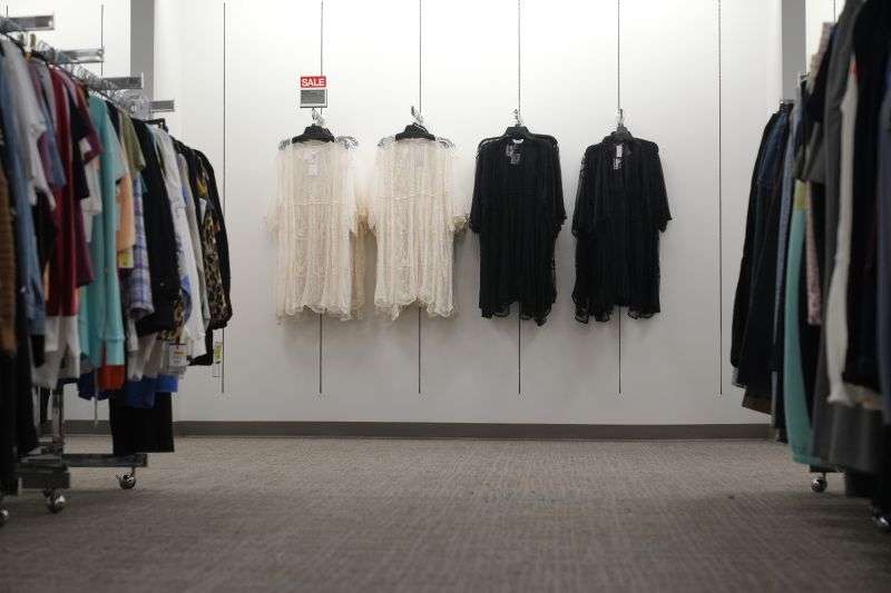 Clothing for sale is displayed at a Kohl's in Clifton, N.J., Jan. 26. A year ago, the store had tables stacked high with sweaters and shirts in a rainbow of colors. Now, it boasts a more edited approach — tables have slim piles of knit shirts that focus on fewer colors.