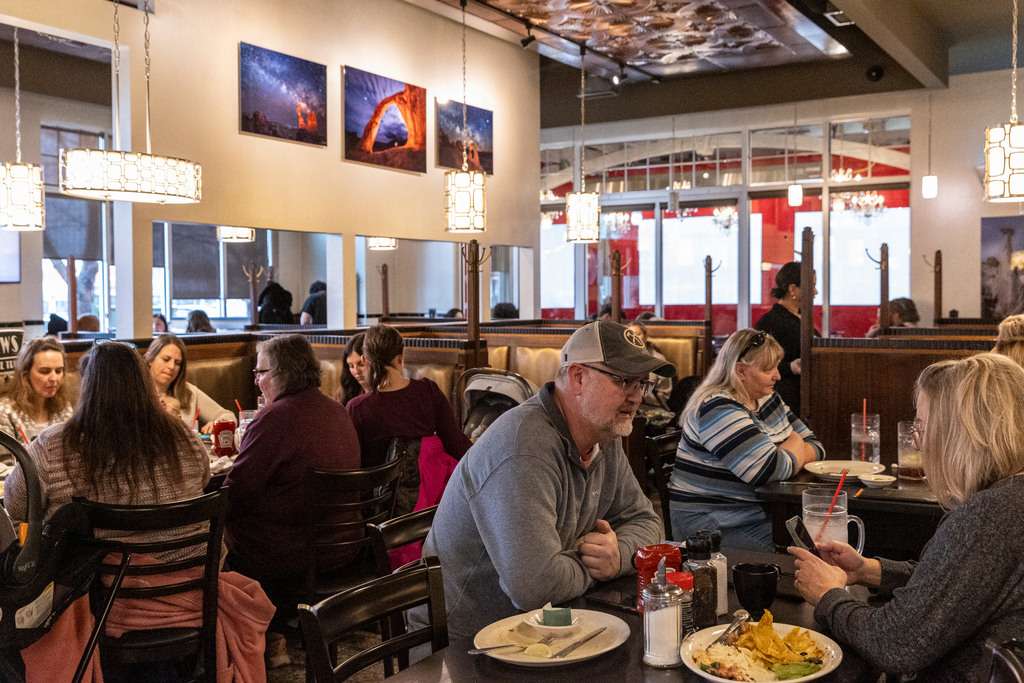 Customers enjoy meals at TRUreligion Pancake & Steakhouse in Orem on Jan. 25. The owner, Jim Leany, is committed to creating a space that feels welcoming and harks back to the Salt Lake City staple, Lamb’s Grill, with original booths, tables, doors and chairs.