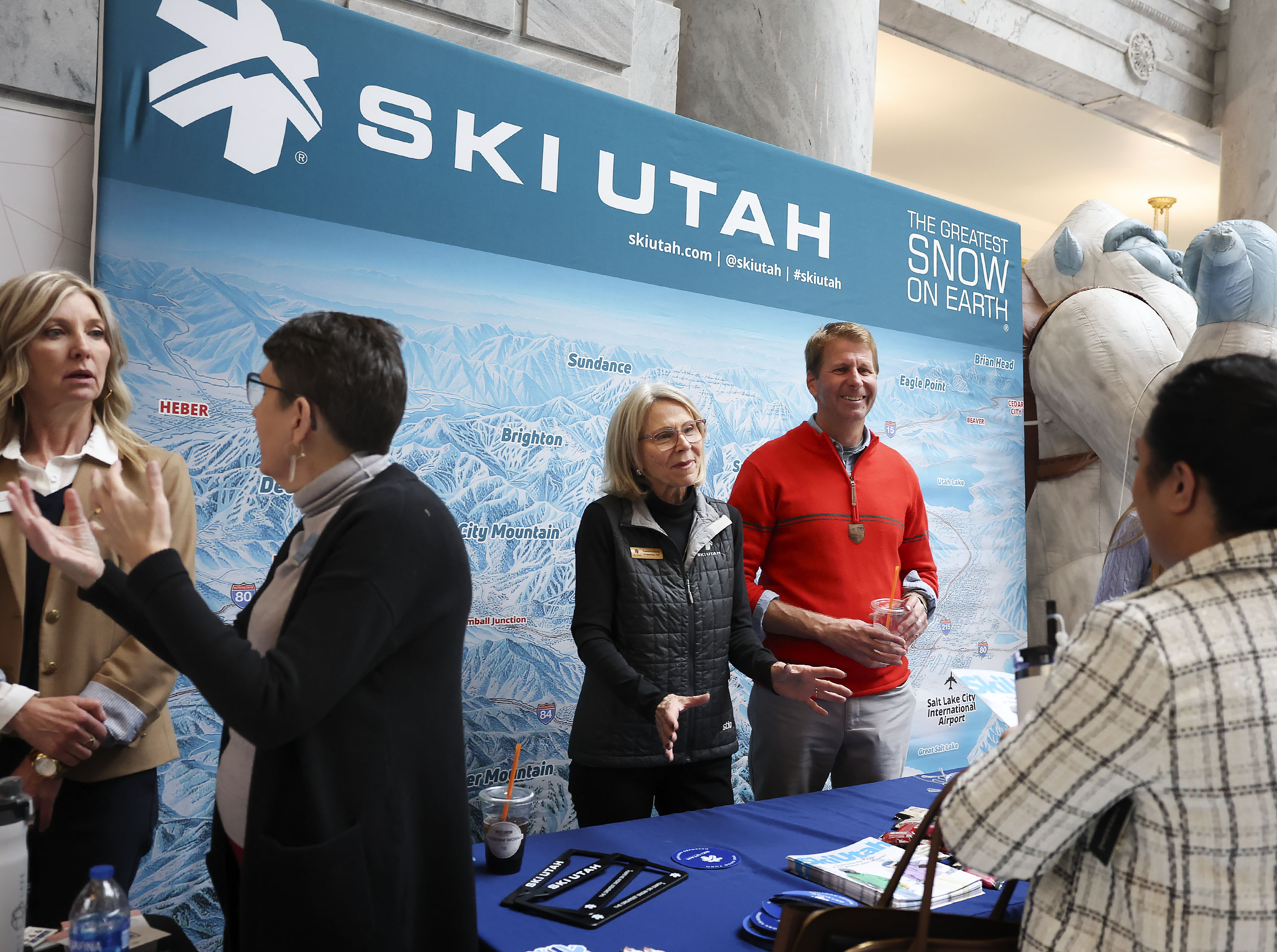 Raelene Davis and Tim Hendrickson of Ski Utah attend the annual Tourism Day on the Hill at the Capitol in Salt Lake City on Friday.