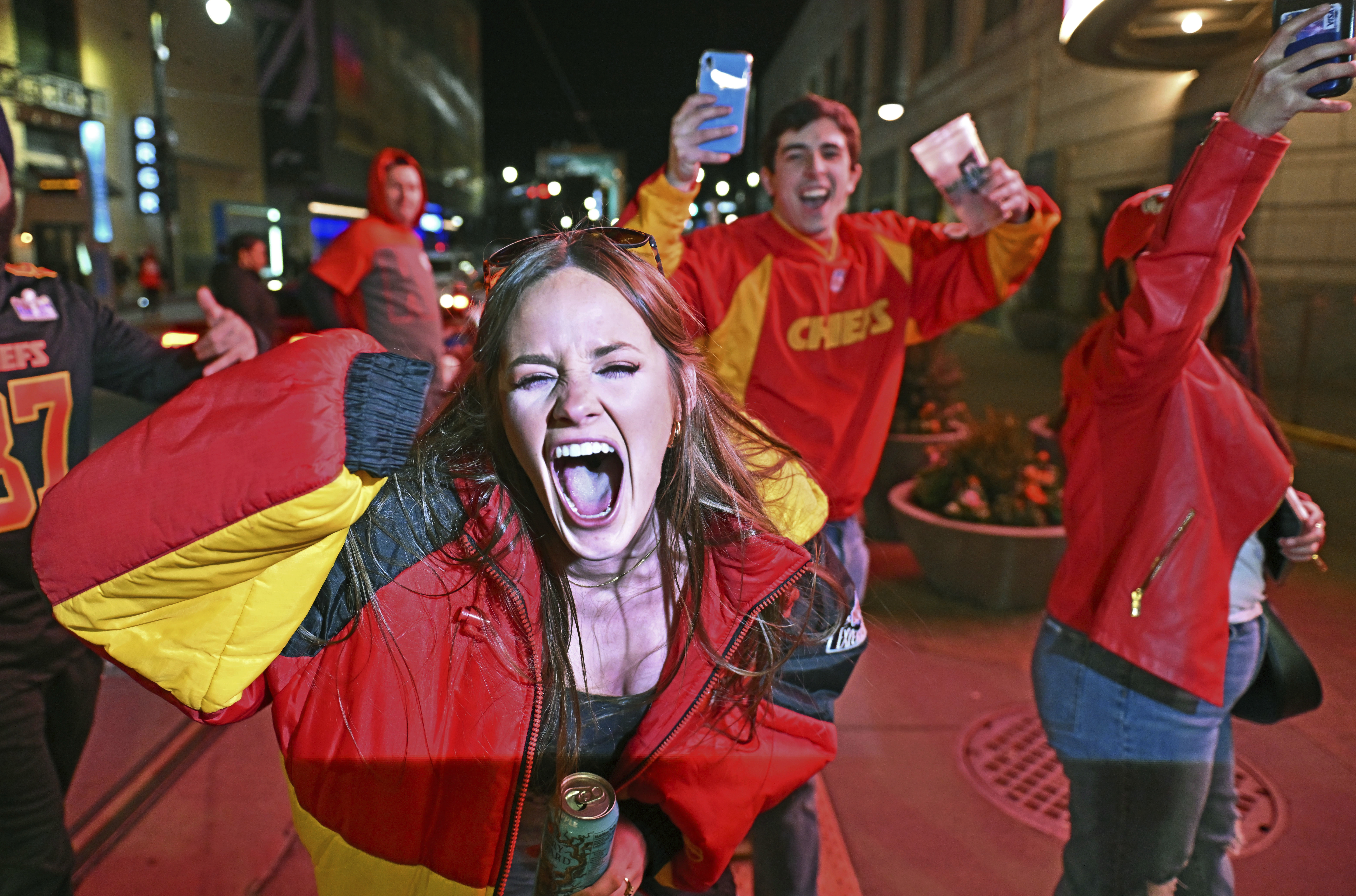 Kansas City Chiefs fans celebrate at the Power and Light District, late Sunday, Feb. 11, 2024, in Kansas City, Mo., after the Chiefs beat the San Francisco 49ers in the Super Bowl NFL football game in overtime. 